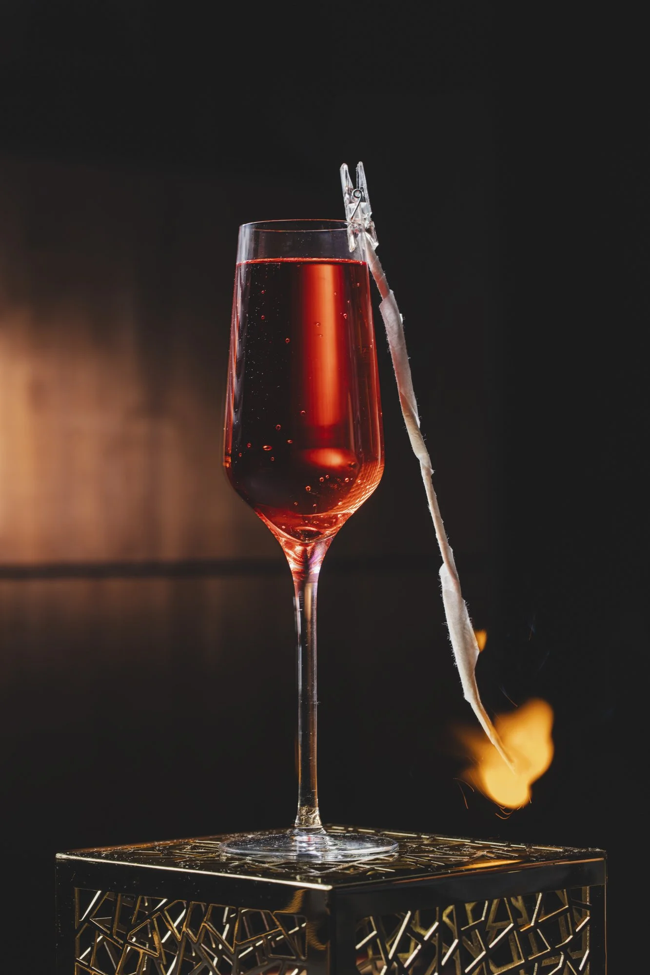 sparkling-red-cocktail-flute-flaming-garnish.jpg