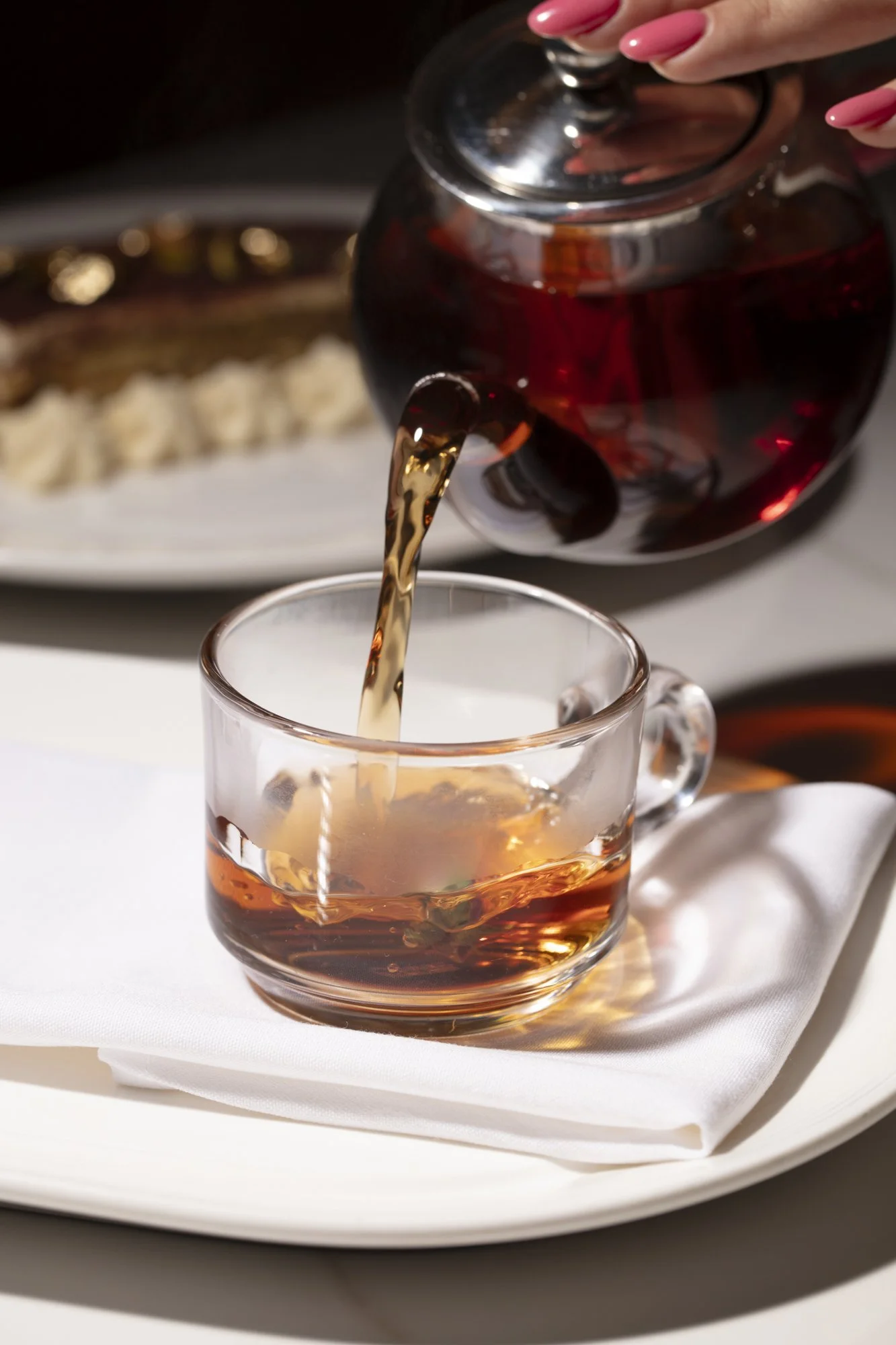 pouring-tea-into-glass-cup.jpg