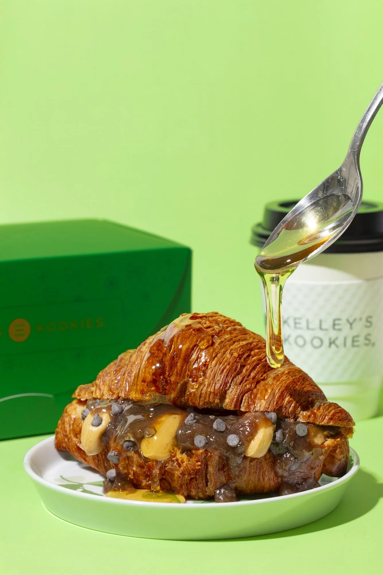 drizzling-honey-on-cookie-croissant-green.jpg