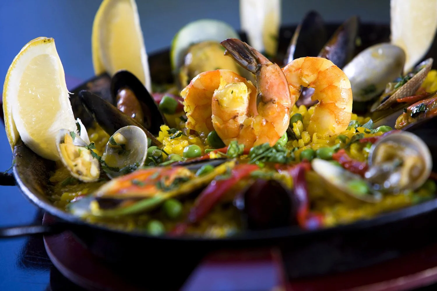 Seafood paella with prawns, mussels and lemon - published cookbook food photography