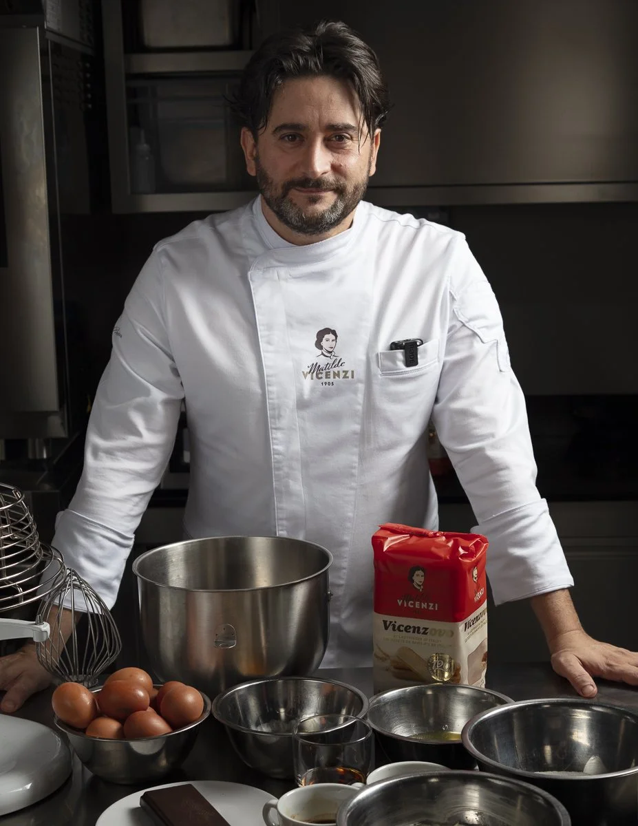 Italian pastry chef in his kitchen during a cookbook shoot in Milan - chef portrait photographerChef in whites working at the pass in a restaurant kitchen - Los Angeles chef portrait photographer