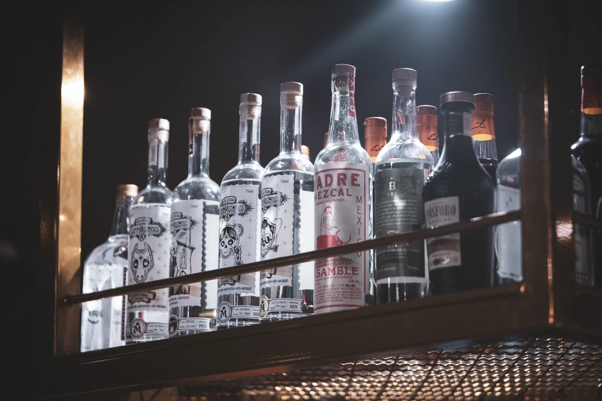 tequila-bottles-on-backlit-bar-shelf.jpg