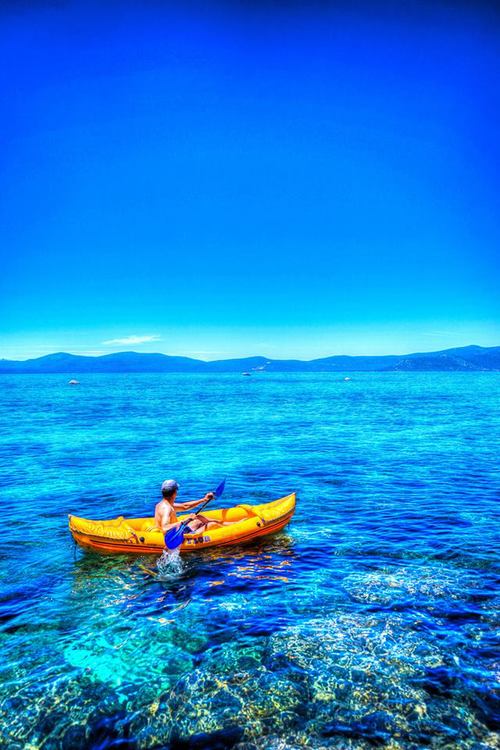 Going for a paddle in Lake Tahoe, CA by Drew Redmond