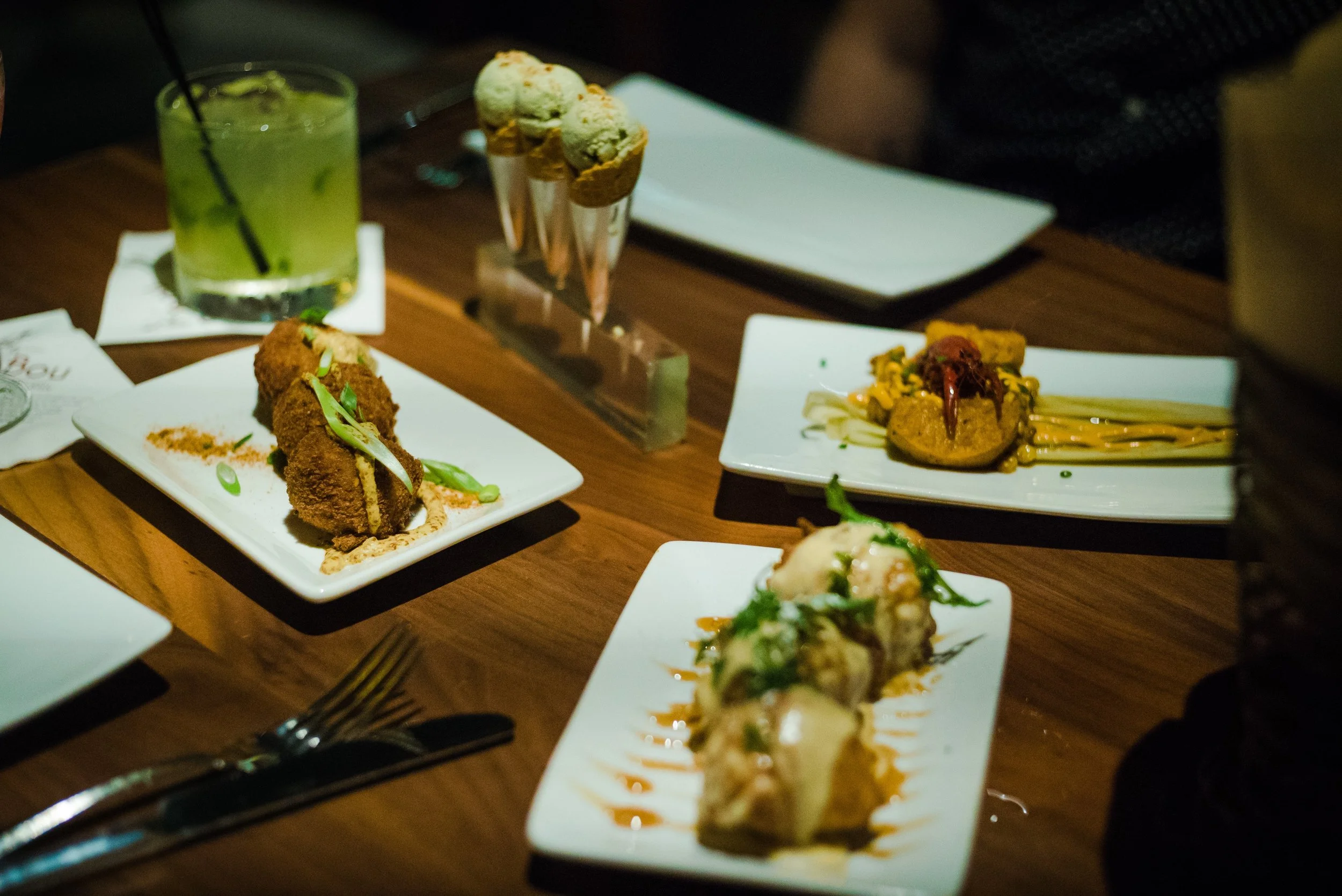 Creative masterpieces from Sobou's chef Juan Carlos: (from top left) Yellowfin Tuna Cones; Crawfish Tamale; Sweet Potato Beignets; Boudin Balls; and a glass of Sunset in the Courtyard. There was a lot going on here, but somehow, it worked! The flavors were amazing. 