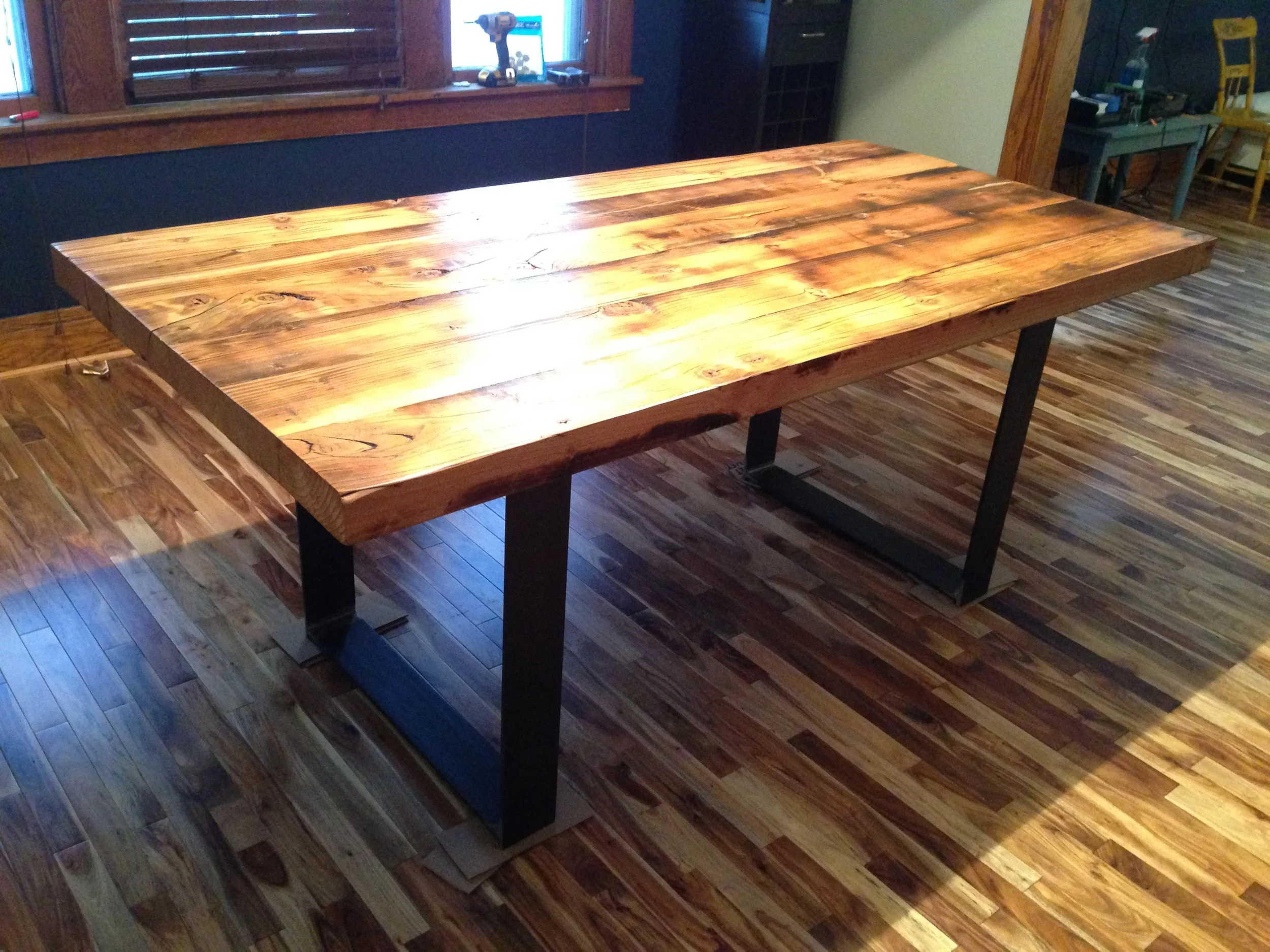 Reclaimed table with custom metal legs