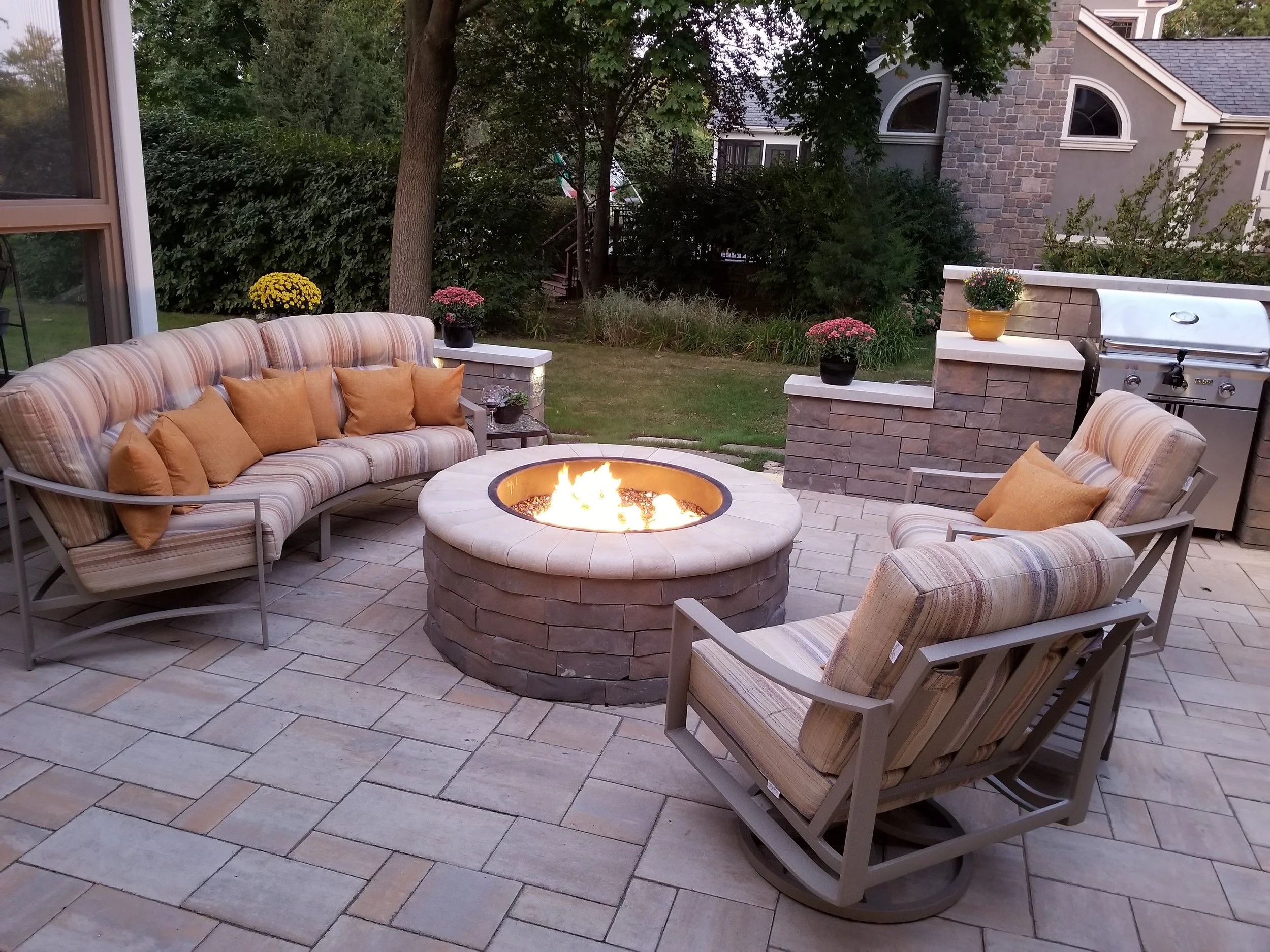 We created this lovely County paver patio with fire pit and an enclosed barbecue with Techobloc walls.