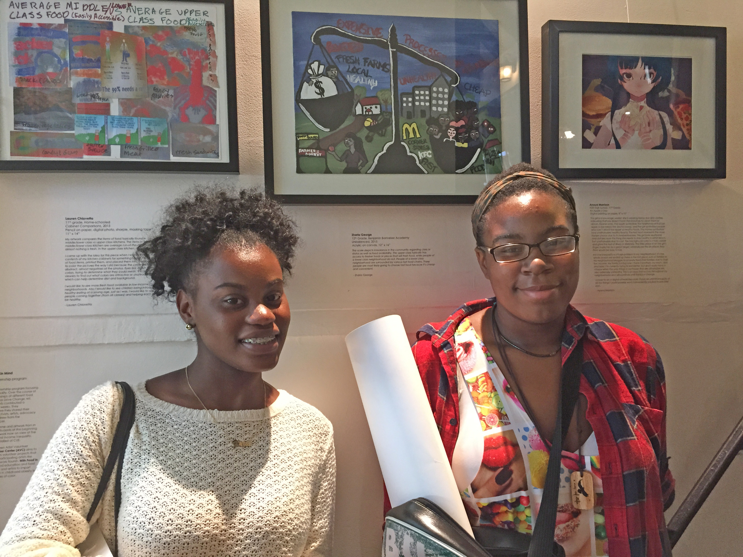  Zharia and Anaya in front of their artwork at the Sensing (In)Equality exhibition at Old Stone House in Brooklyn. 