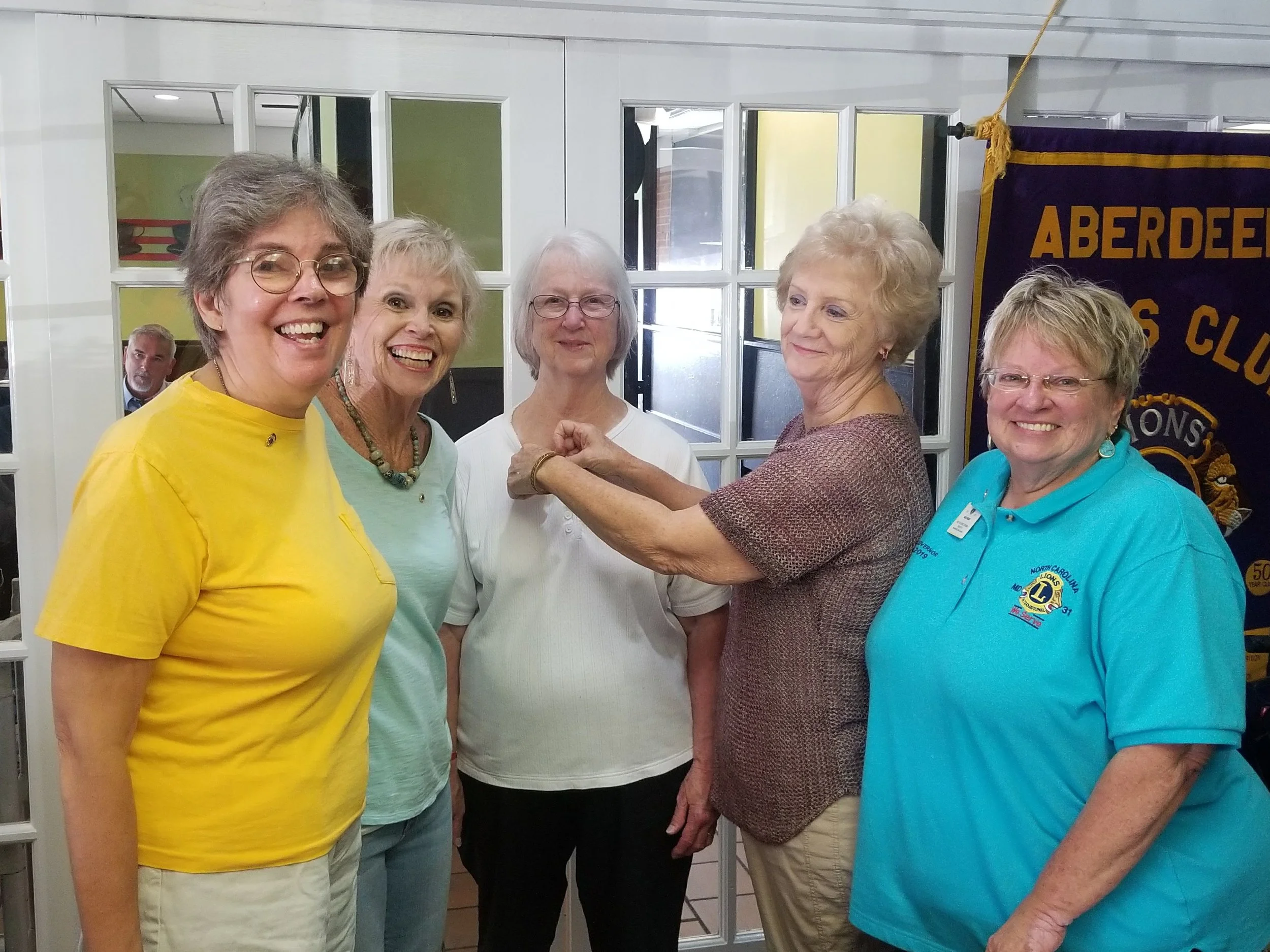 New Lion Deborah Kilcollin, her sponsor Kay Mack, new Aberdeen Lion Jeannette Roberts, Lion Connie Monds, and 1st Vice District Governor Susie Dailey
