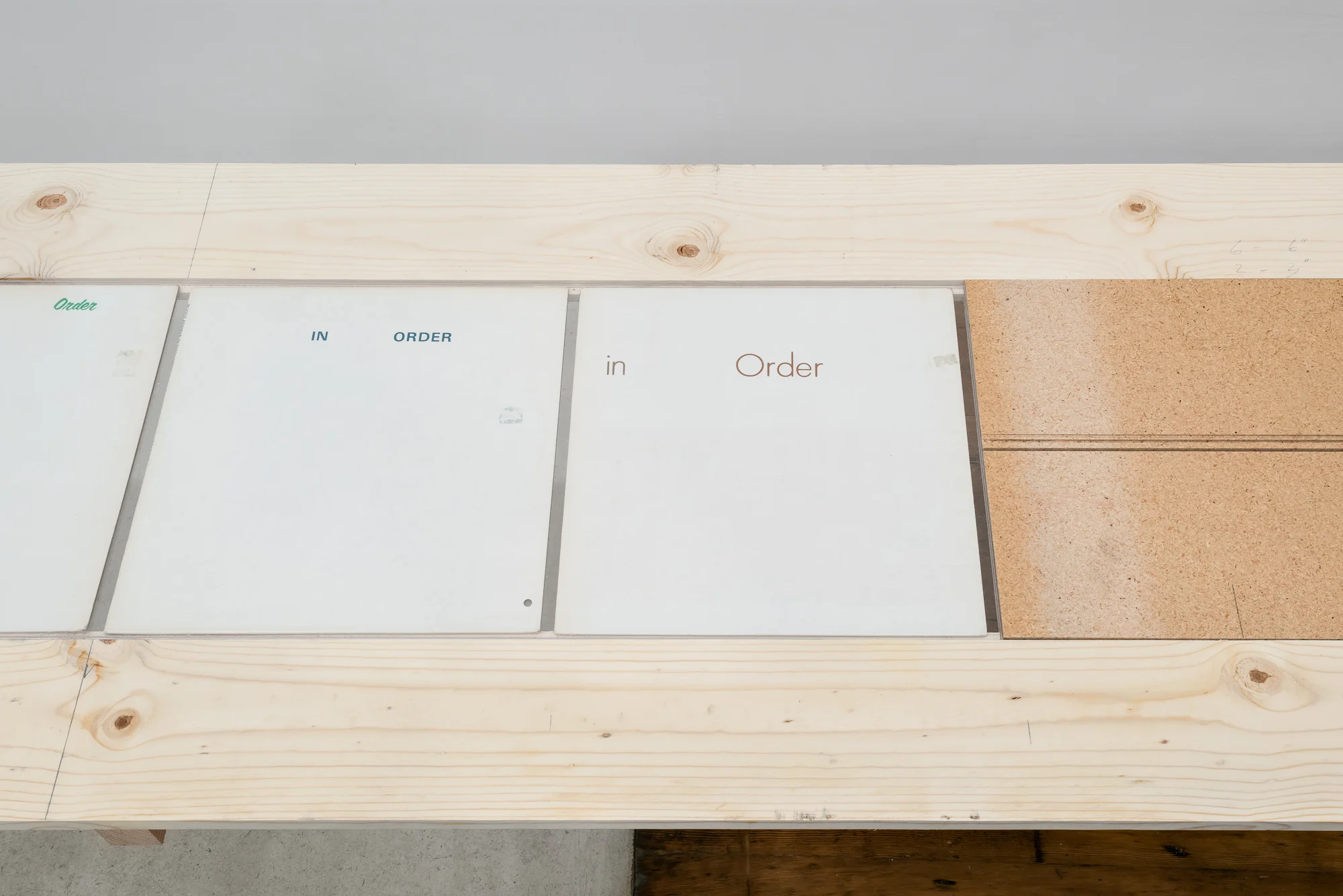 In Order Erased record covers table/vitrine