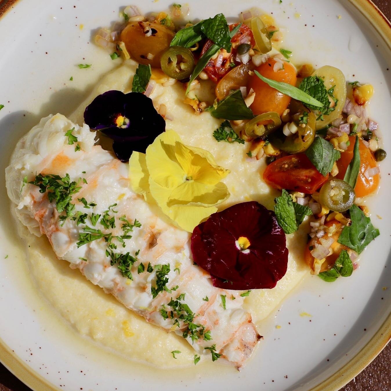 Butter Poached 10-12 oz. Cold Water Lobster Tail 🧈🦞 
Served over a Creamy Pecorino Polenta with a Roasted Summer Salad with Pine Nuts