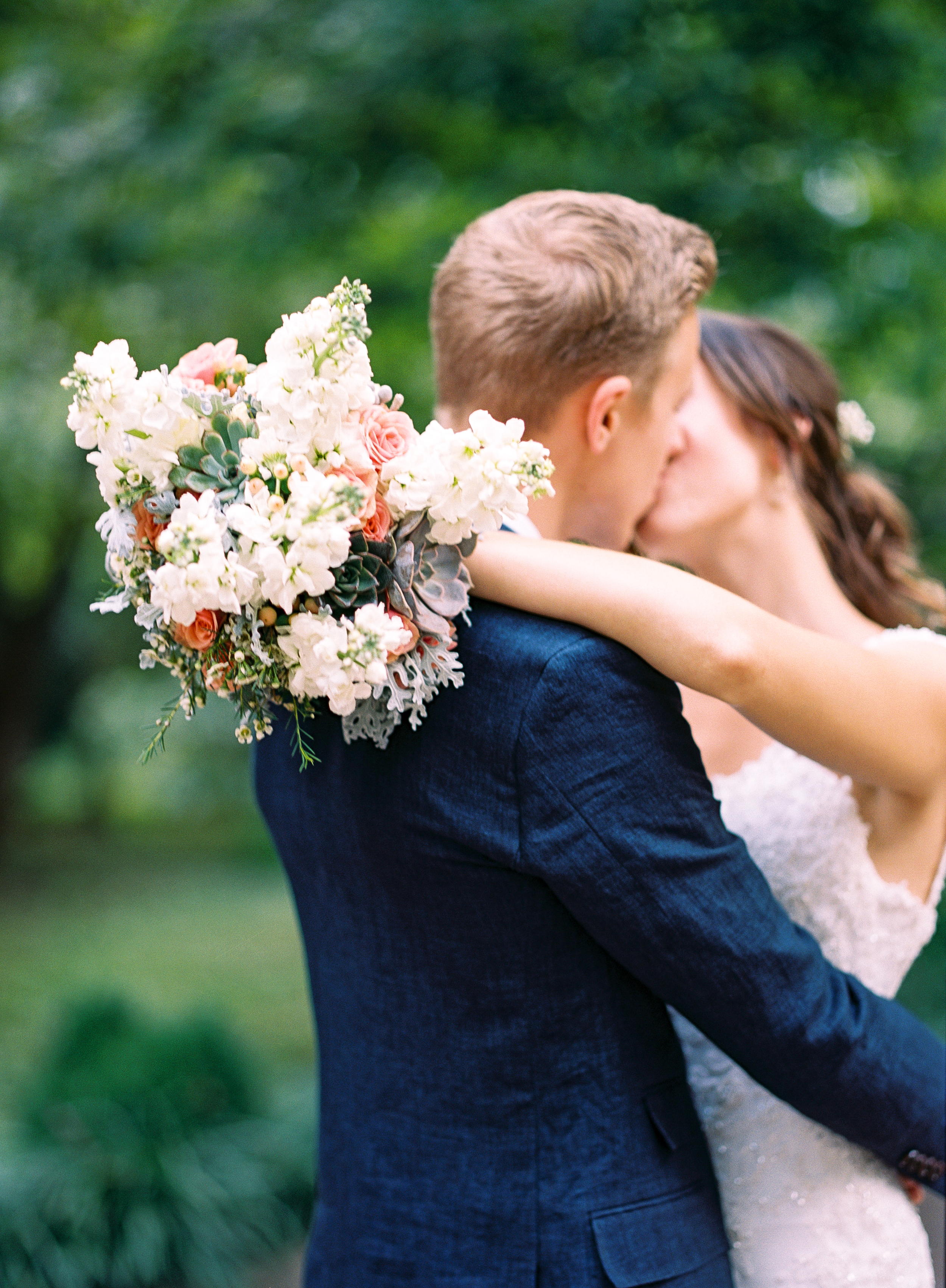 Whimscal bride and groom kiss // Bridal Bouquet