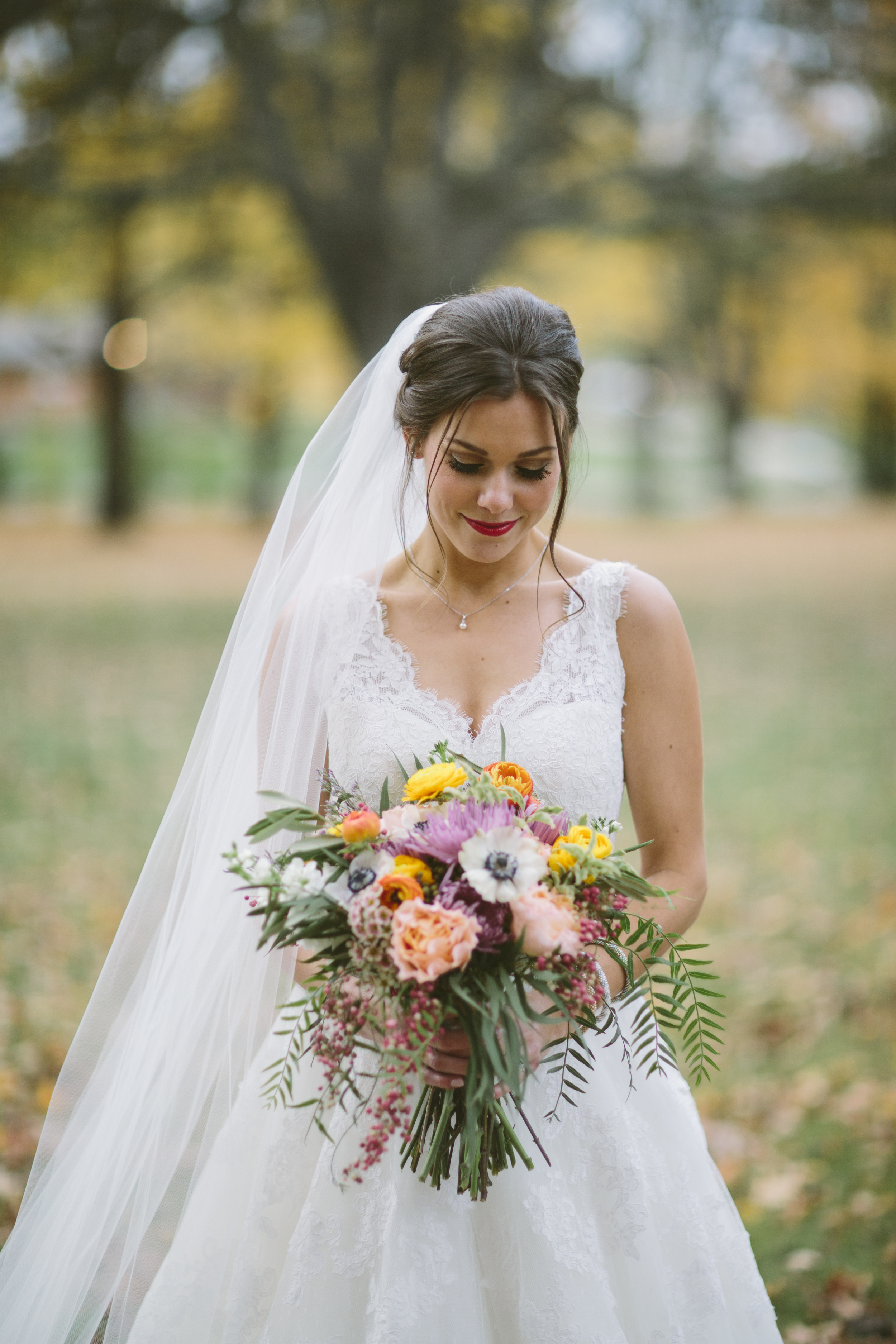 Fall bride with bouquet // Riverwood Mansion Wedding