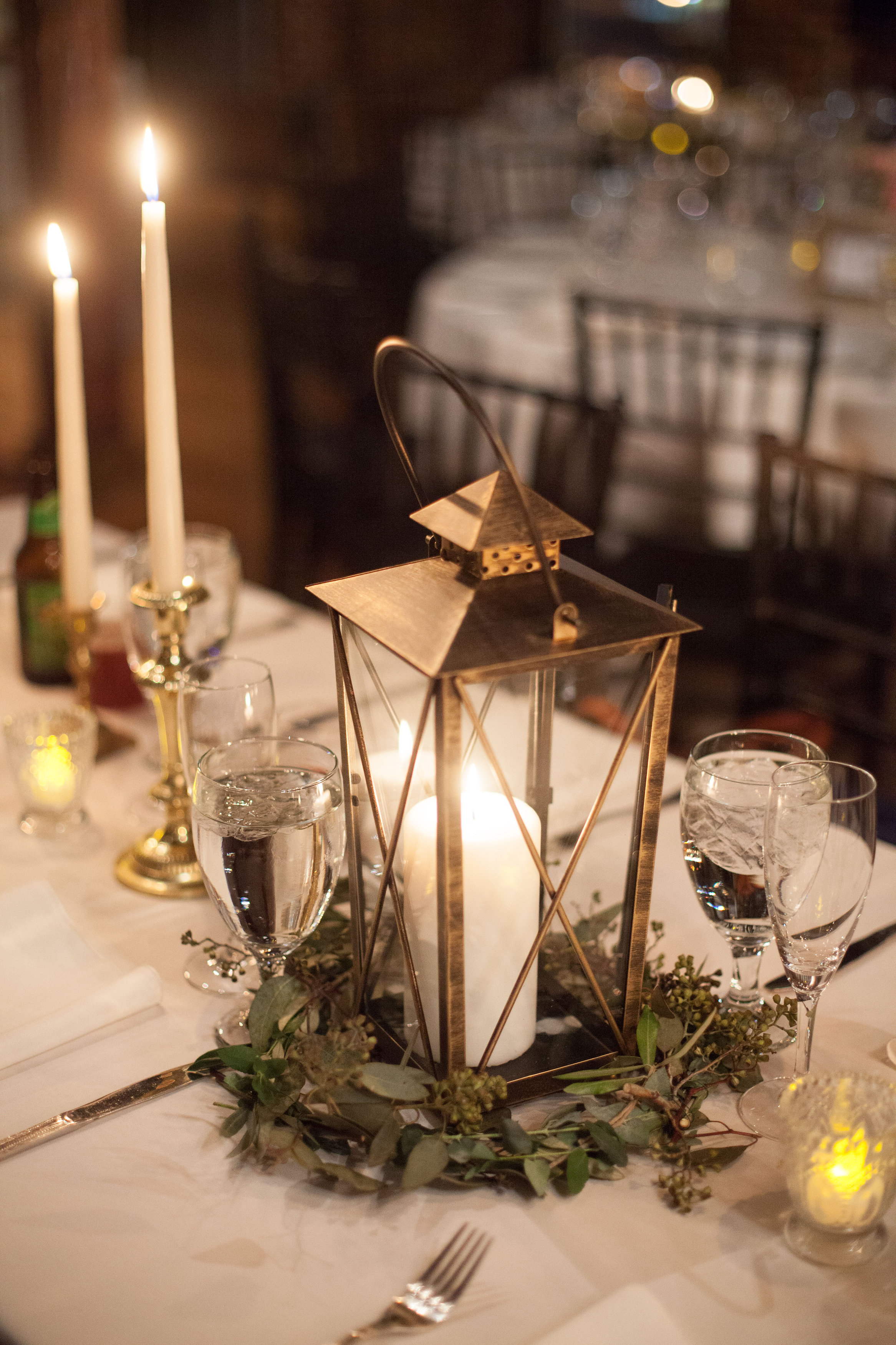Lantern centerpieces with greenery // Nashville Wedding Floral Design