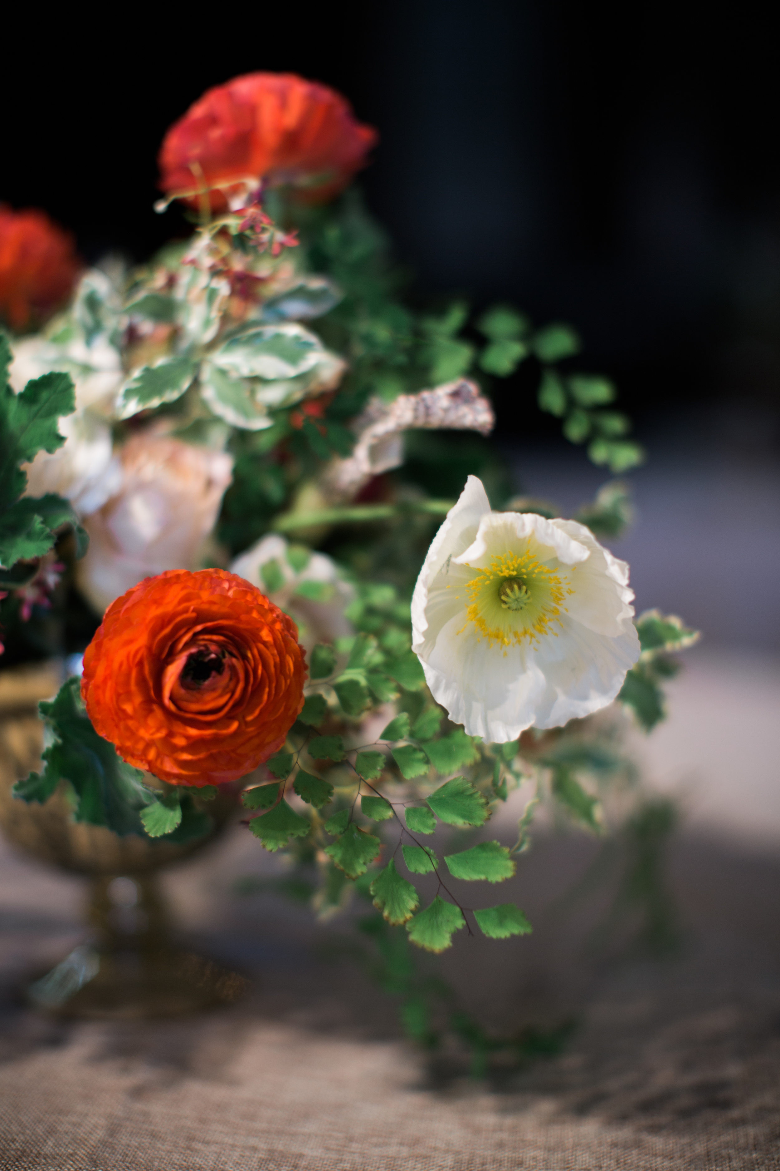 Centerpiece with poppies and ranunculus // Nashville Wedding Floral Design