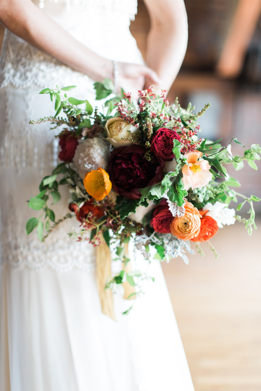 Red peonies, garden roses, ranunculus, and honeysuckle / Nashville Wedding Florist