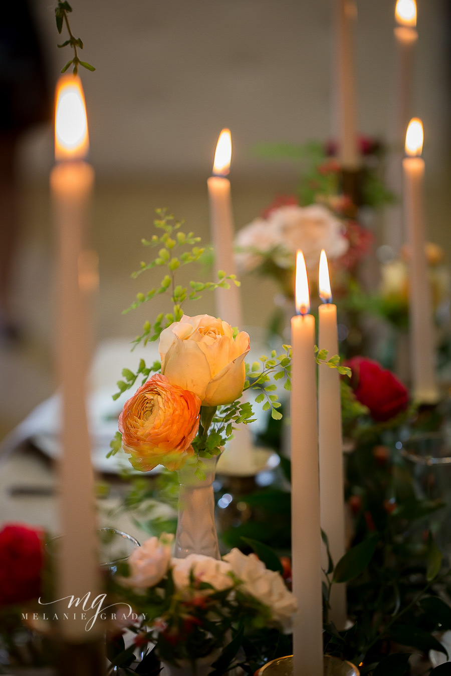 Head table with hanging arrangement, candles, and garland // Nashville Wedding Florist