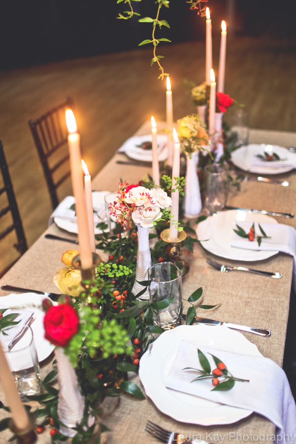 Head Table with garland, tapers, and bud vases // Nashville Wedding Floral Design at Cannery One