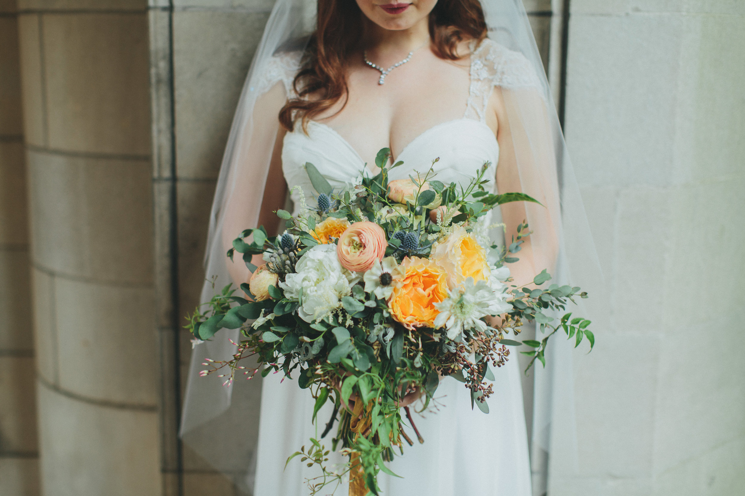 Organic bridal bouquet with peach garden roses, ranunculus, and anemones // Nashville Wedding Florist