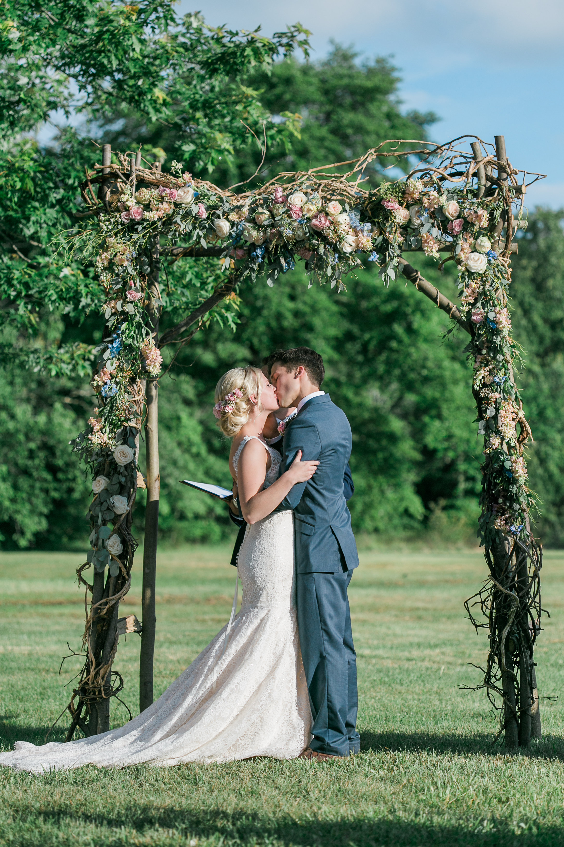 Wood, rustic arch with flowers // Nashville Wedding Floral Design