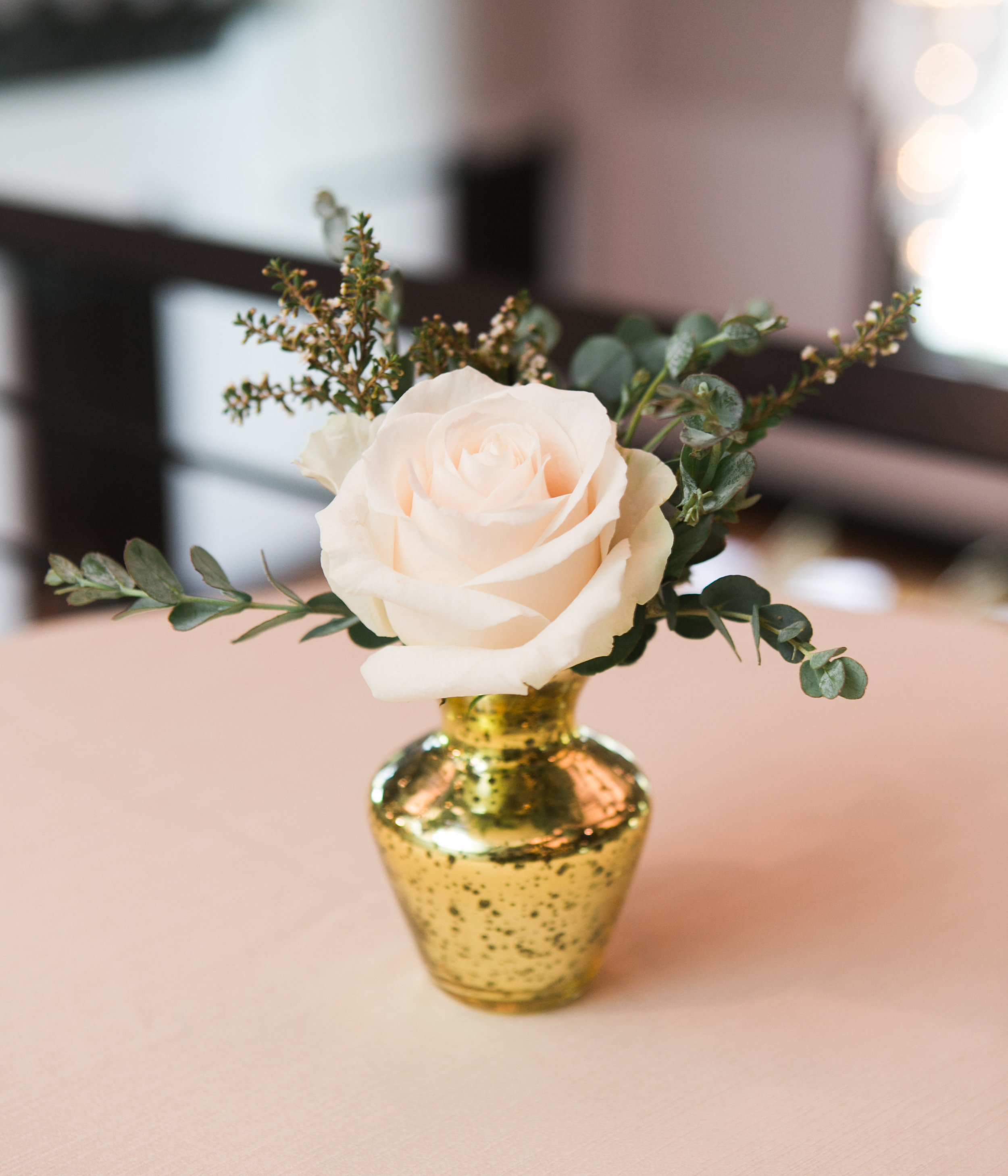 Gold mercury glass bud vases with greenery and blush rose