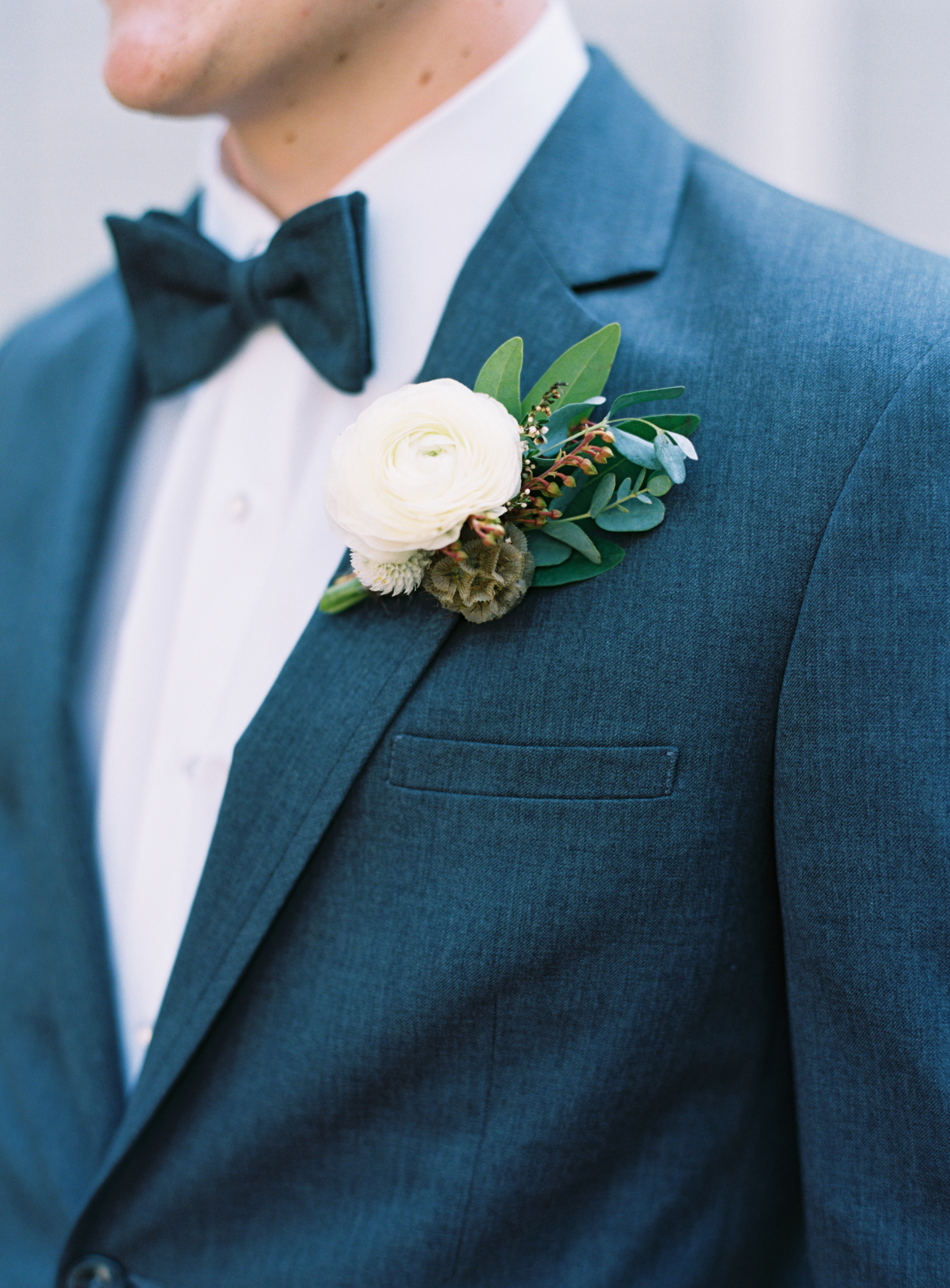 Natural, rustic boutonniere with ranunculus // Nashville Wedding Floral Design