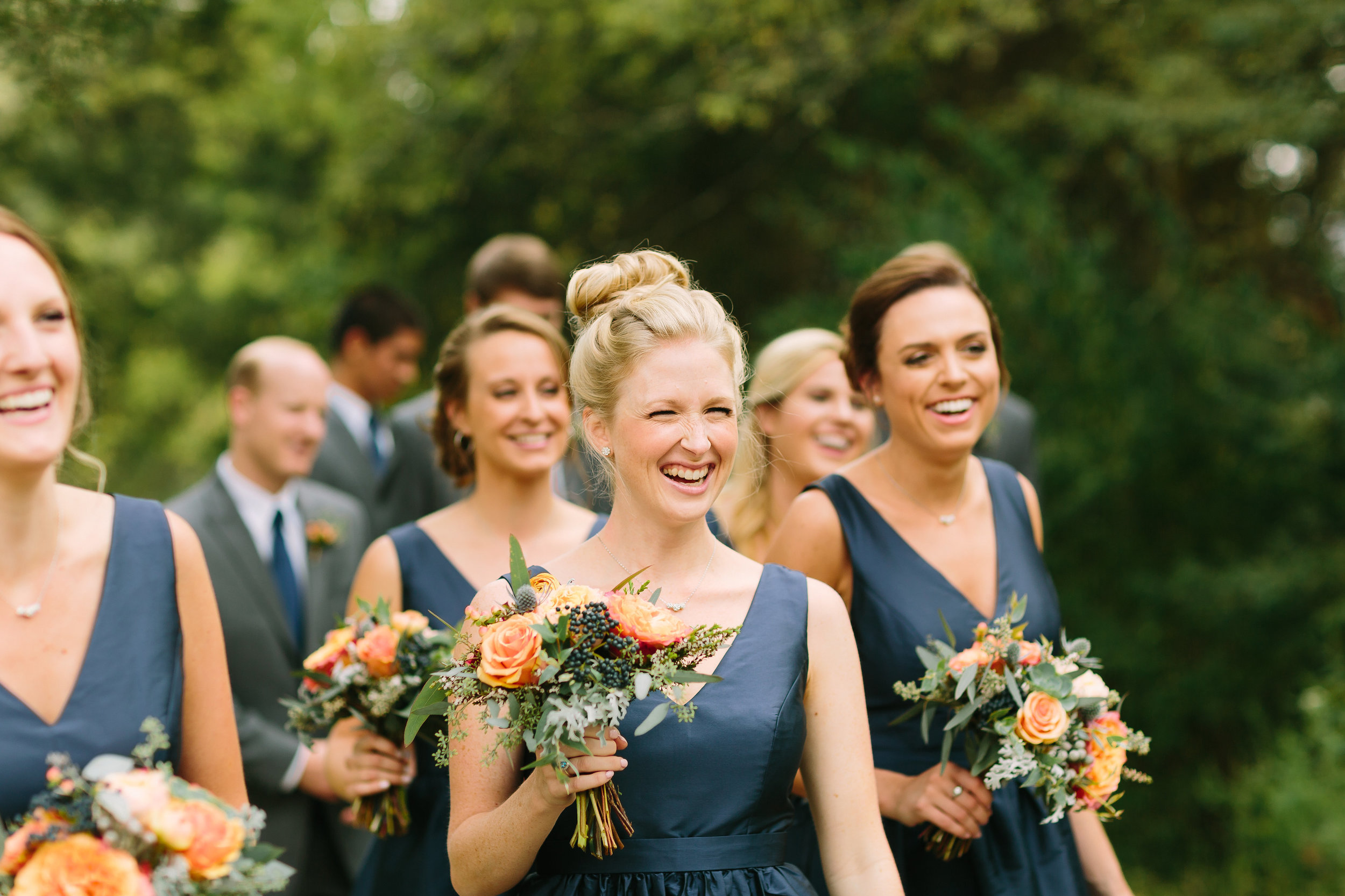 Bridesmaids in navy with coral flowers // Nashville Wedding Florist