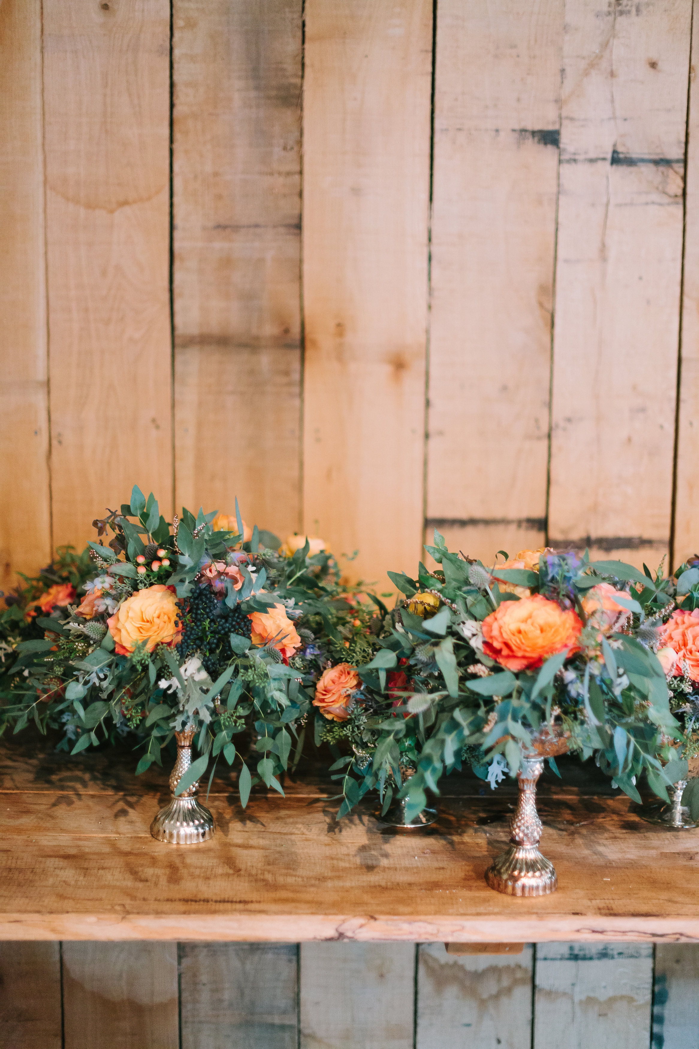 Coral and navy floral arrangements