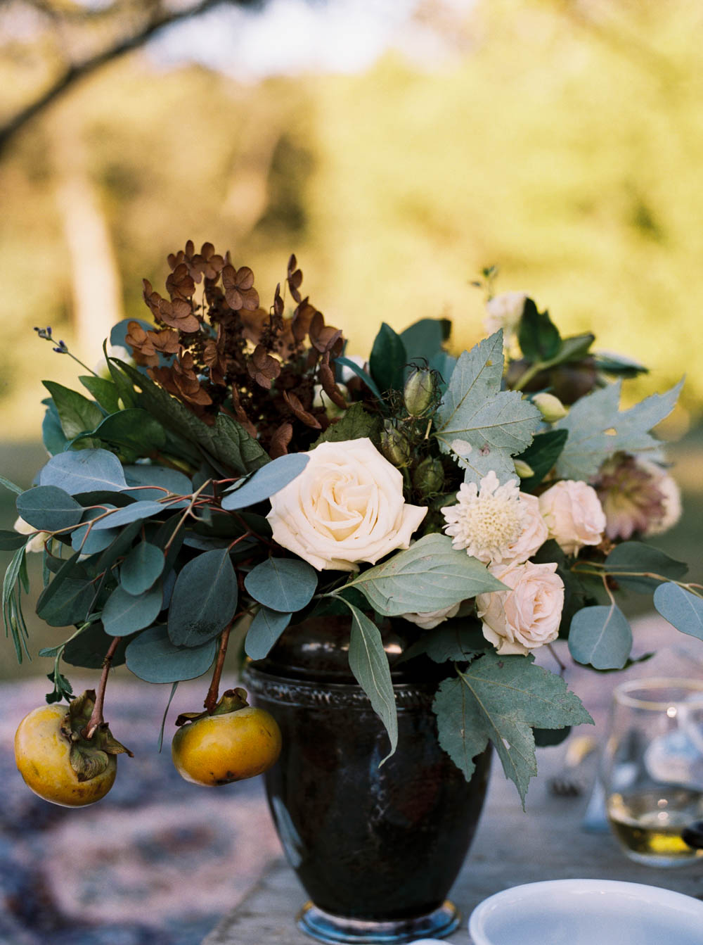 Lush Thanksgiving centerpiece with persimmons // Nashville Inspiration Shoot