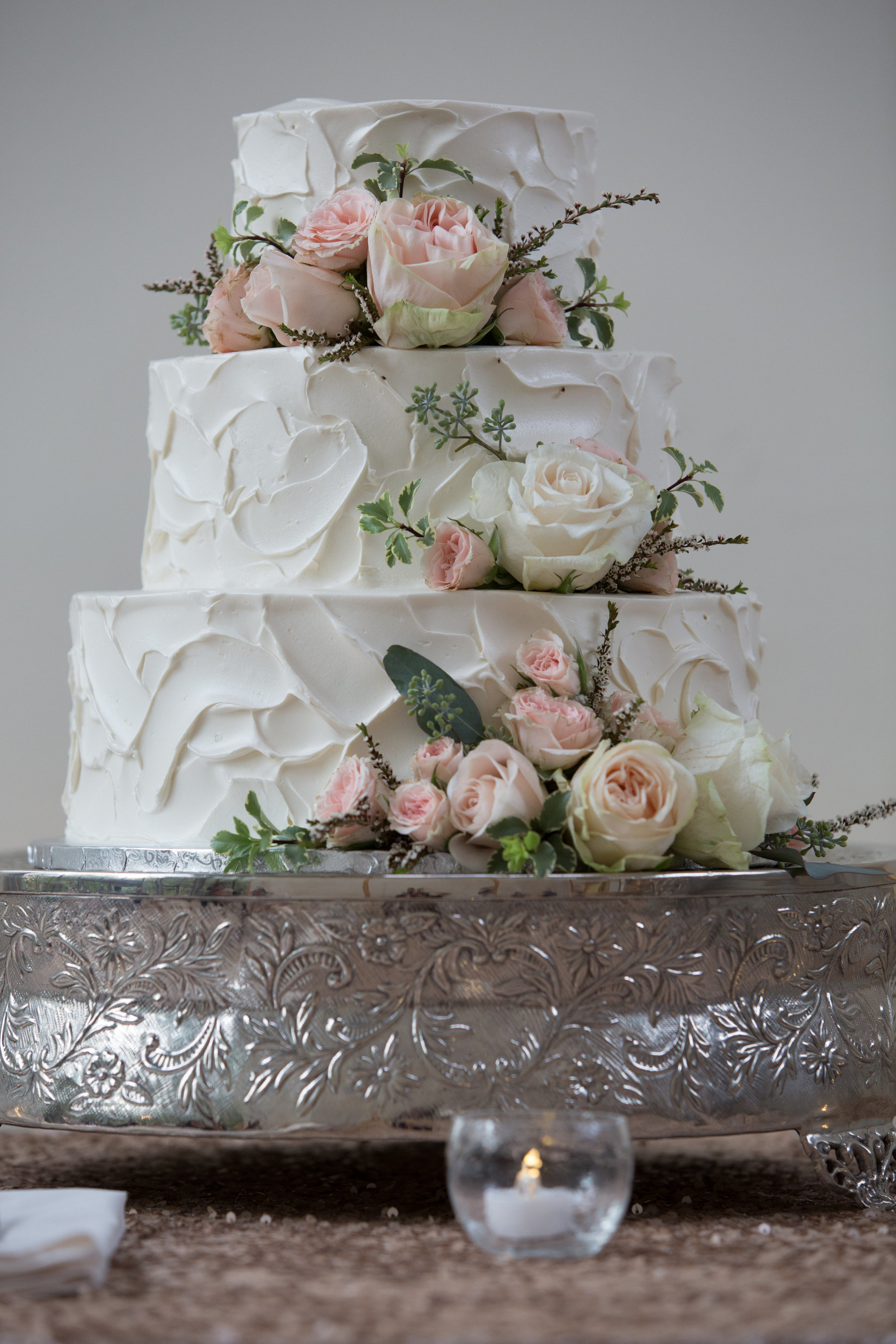 Wedding cake with garden roses and greenery