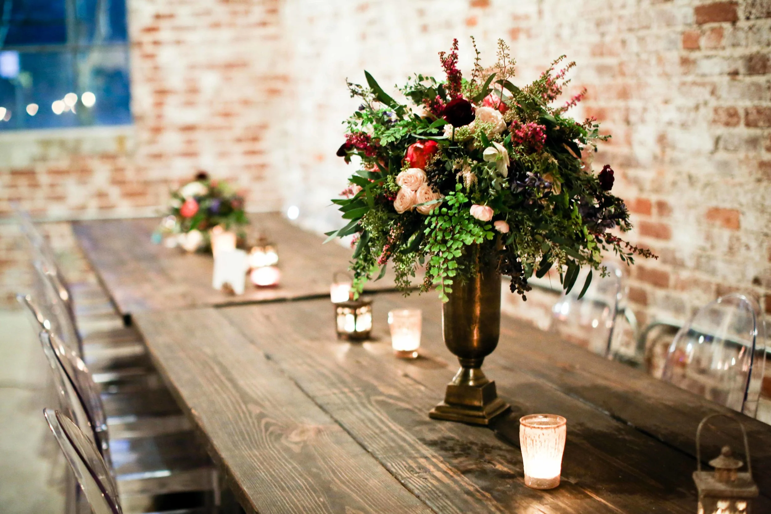 Loose greenery centerpiece with pops of color // Nashville to Atlanta Florist