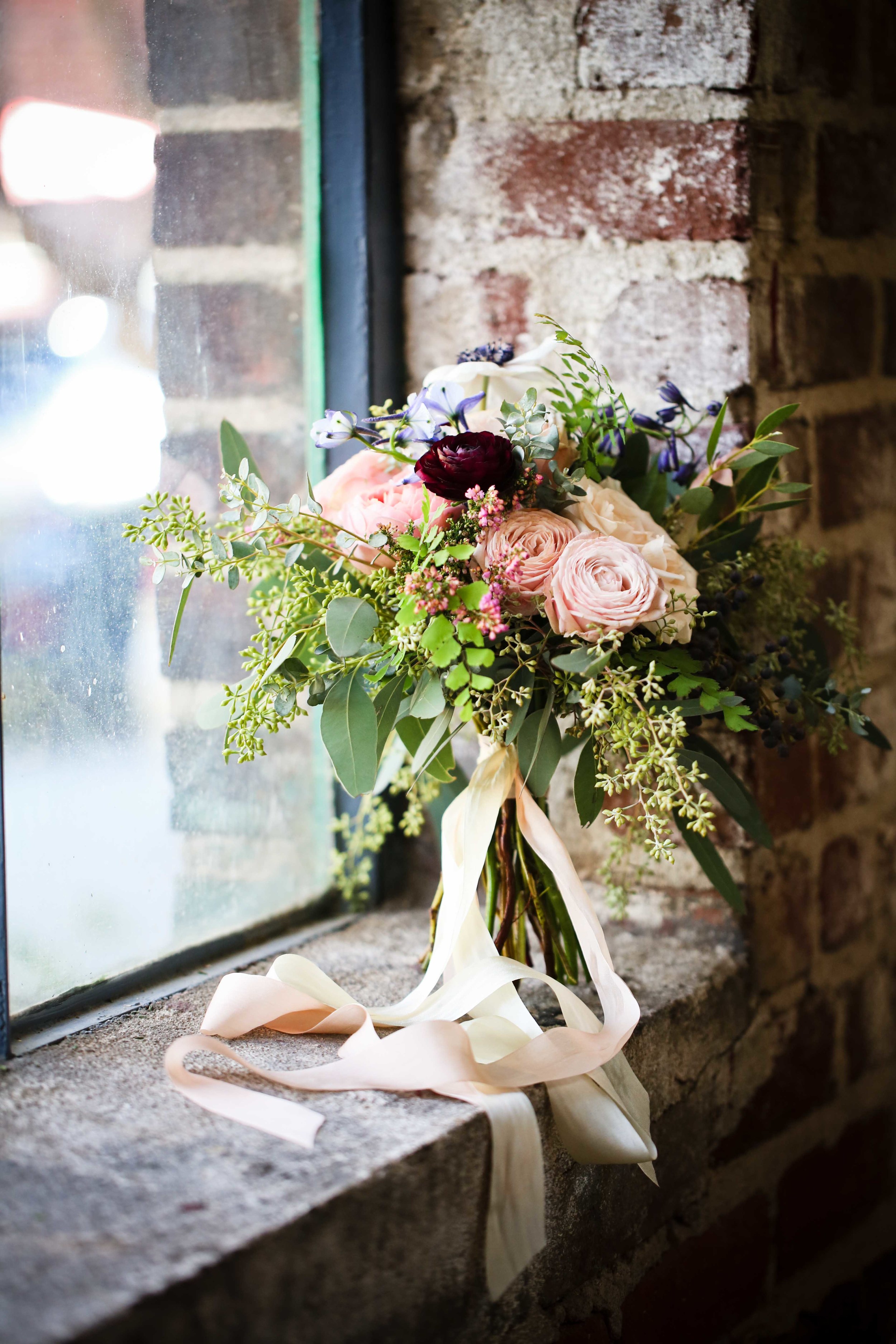 Loose, organic bouquet with touches of deep plum and light blue //