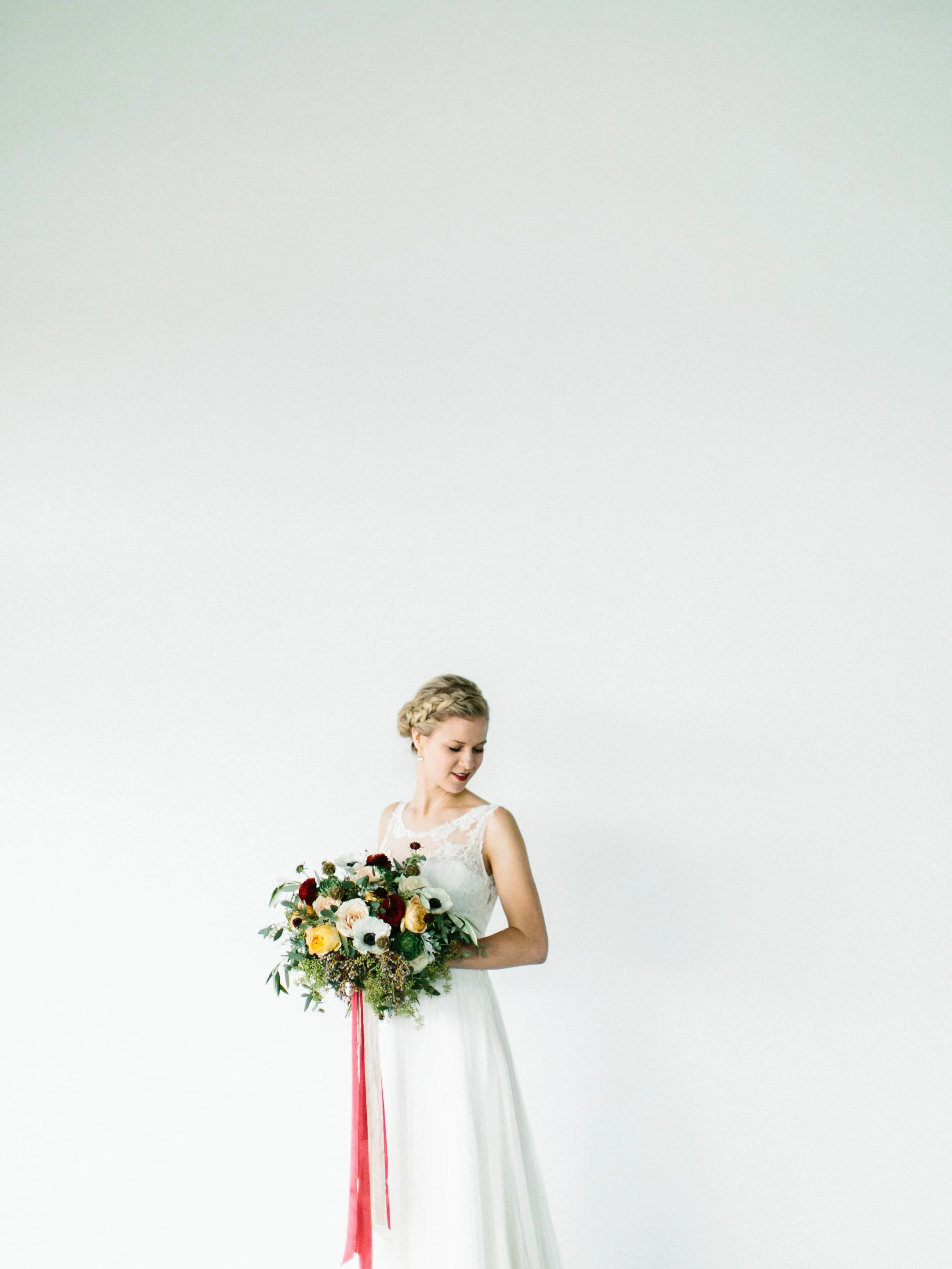 Loose, organic bridal bouquet with streaming cranberry silk ribbon // Destination Floral Design