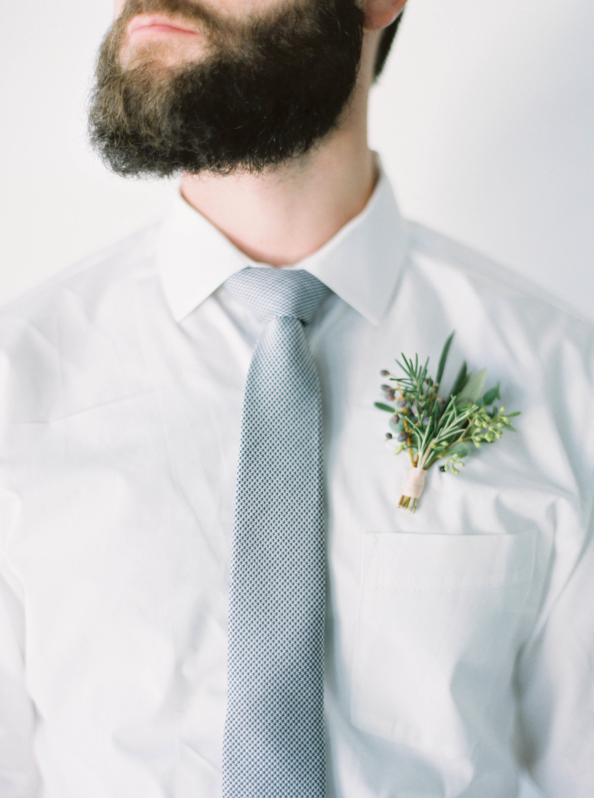 Herbs, greenery, and berry boutonniere // Natural Destination Floral Design