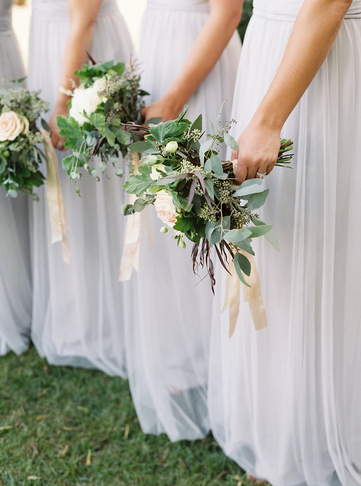 Soft blue bridesmaid dresses with blush, neutral, and greenery bouquets // Nashville Botanic Garden Wedding Florist