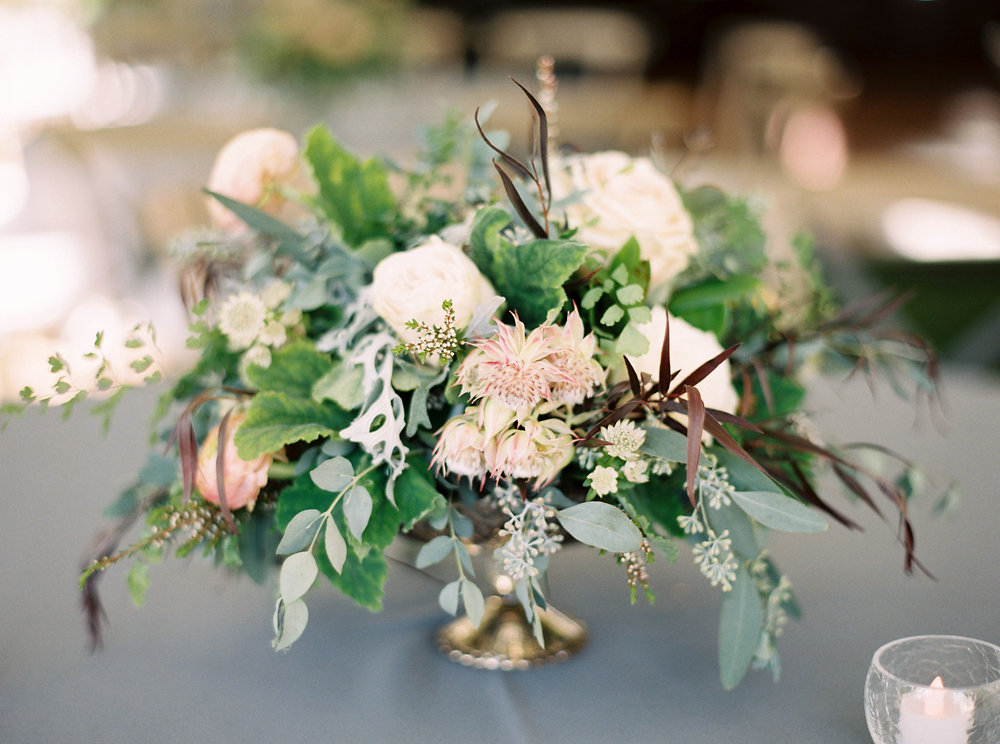 Organic, untamed centerpiece with protea and ranunculus // Natural Floral Design