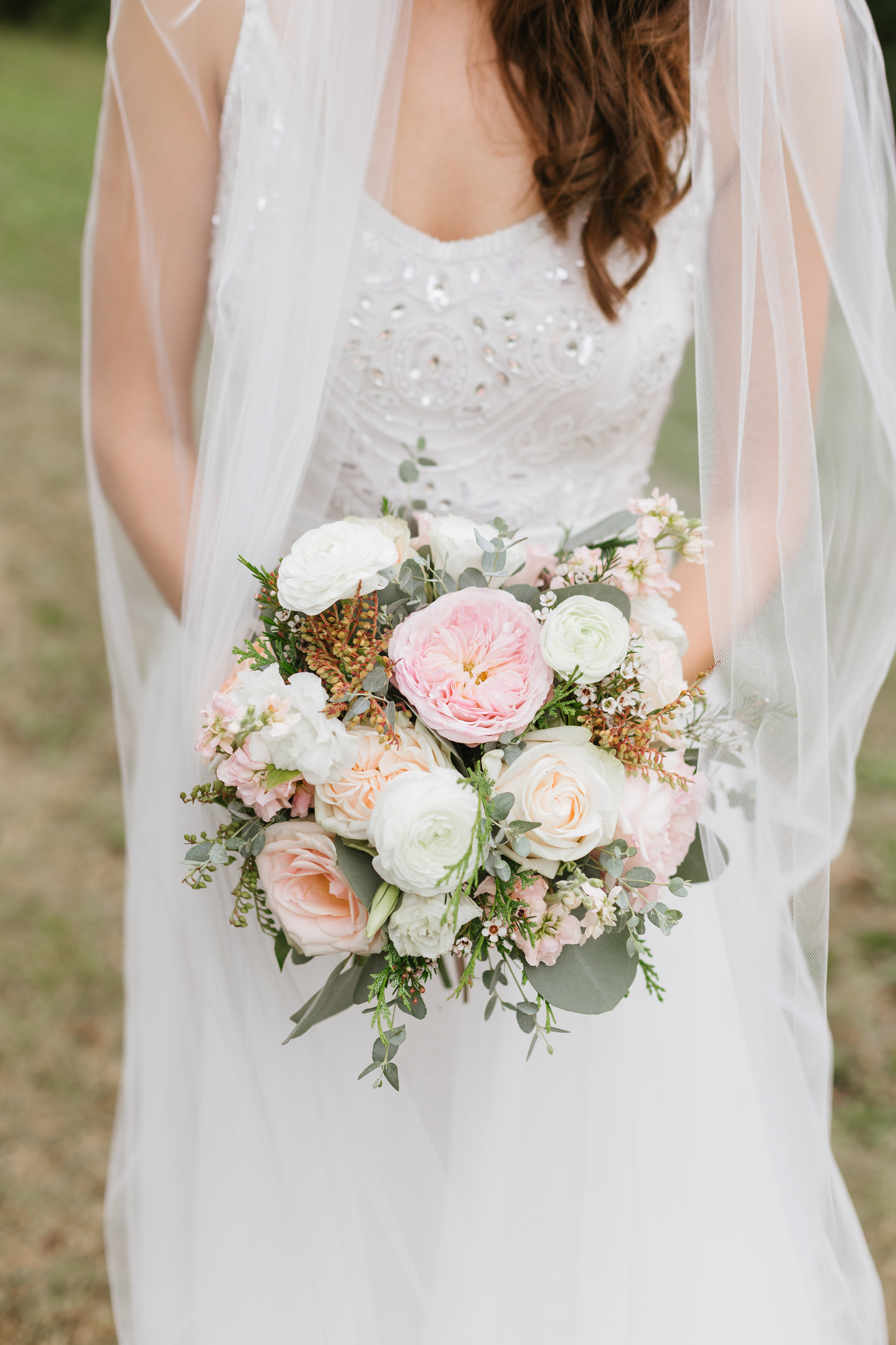 Bridal bouquet with david austin garden roses, pieris, and wildflowers