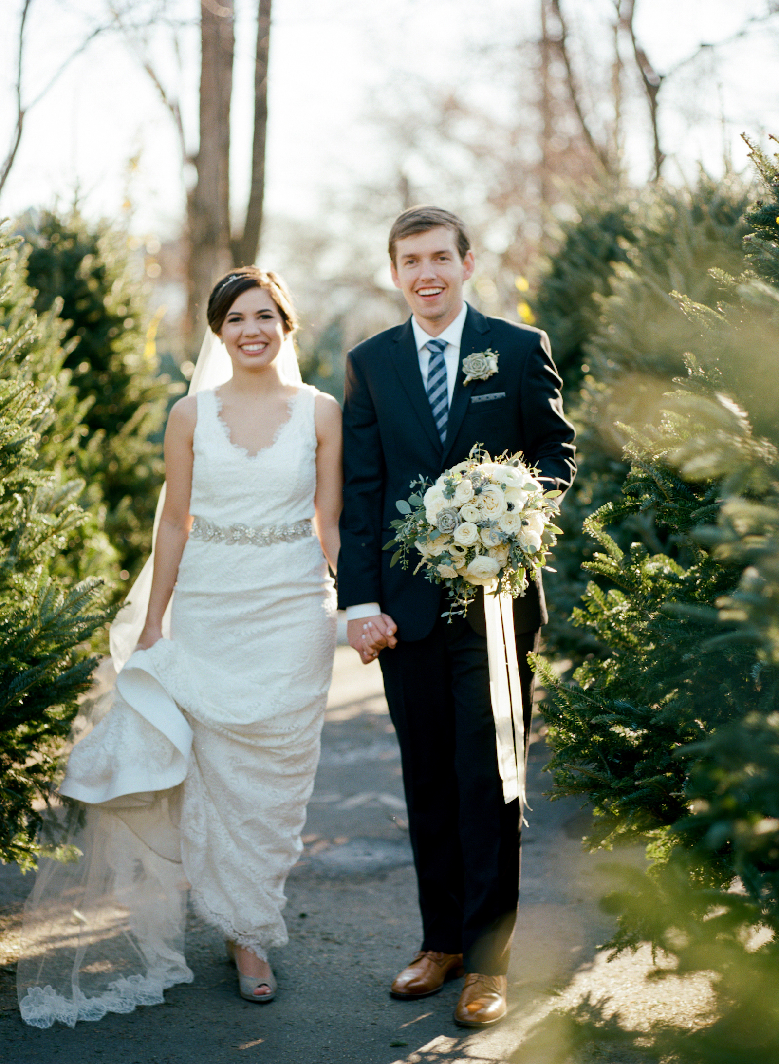 Bride and Groom in Christmas Tree Lot // Southern Wedding Floral Design