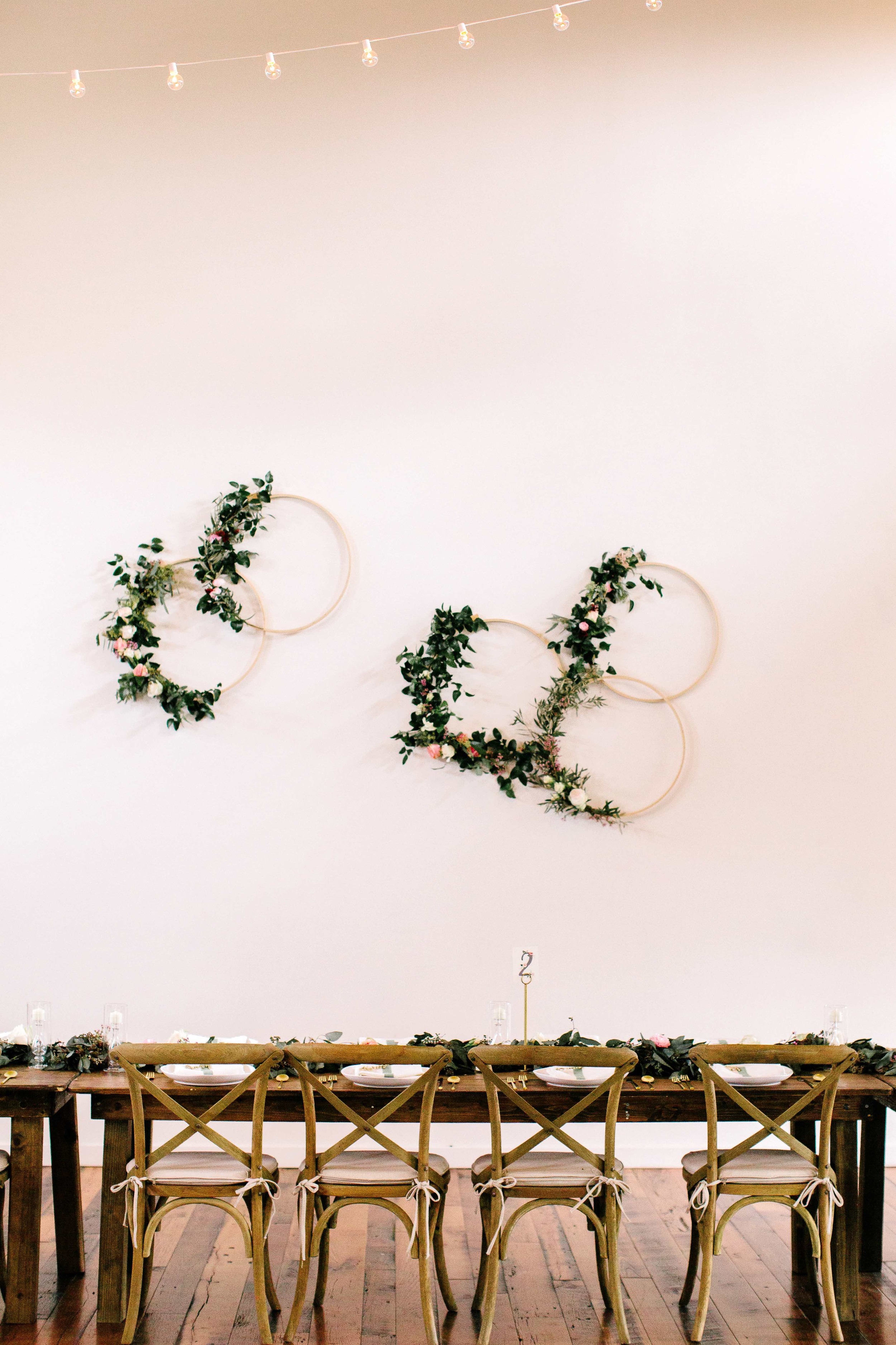 Wooden hoops with floral accents // Floral Installation on white wall for Nashville Wedding at the Cordelle