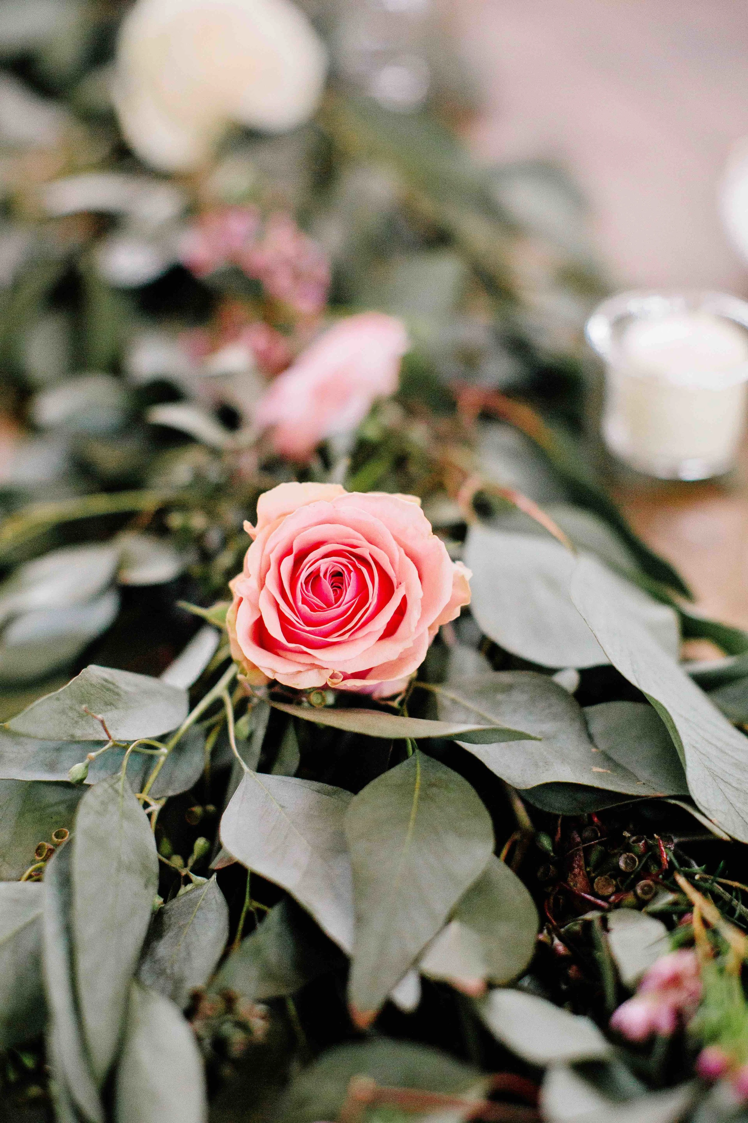 Rose accents in greenery table runners // Nashville Wedding Flowers