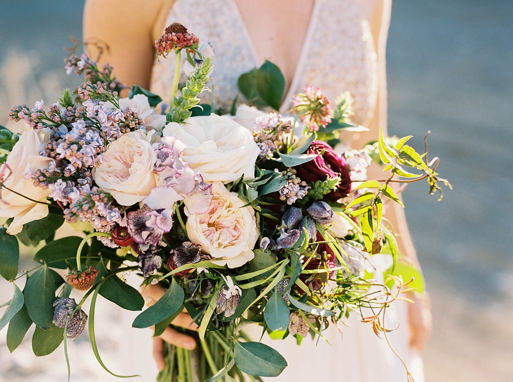 Lush bridal bouquet with lilac, sweet pea, garden roses, and ranunculus // Nashville Wedding Florist