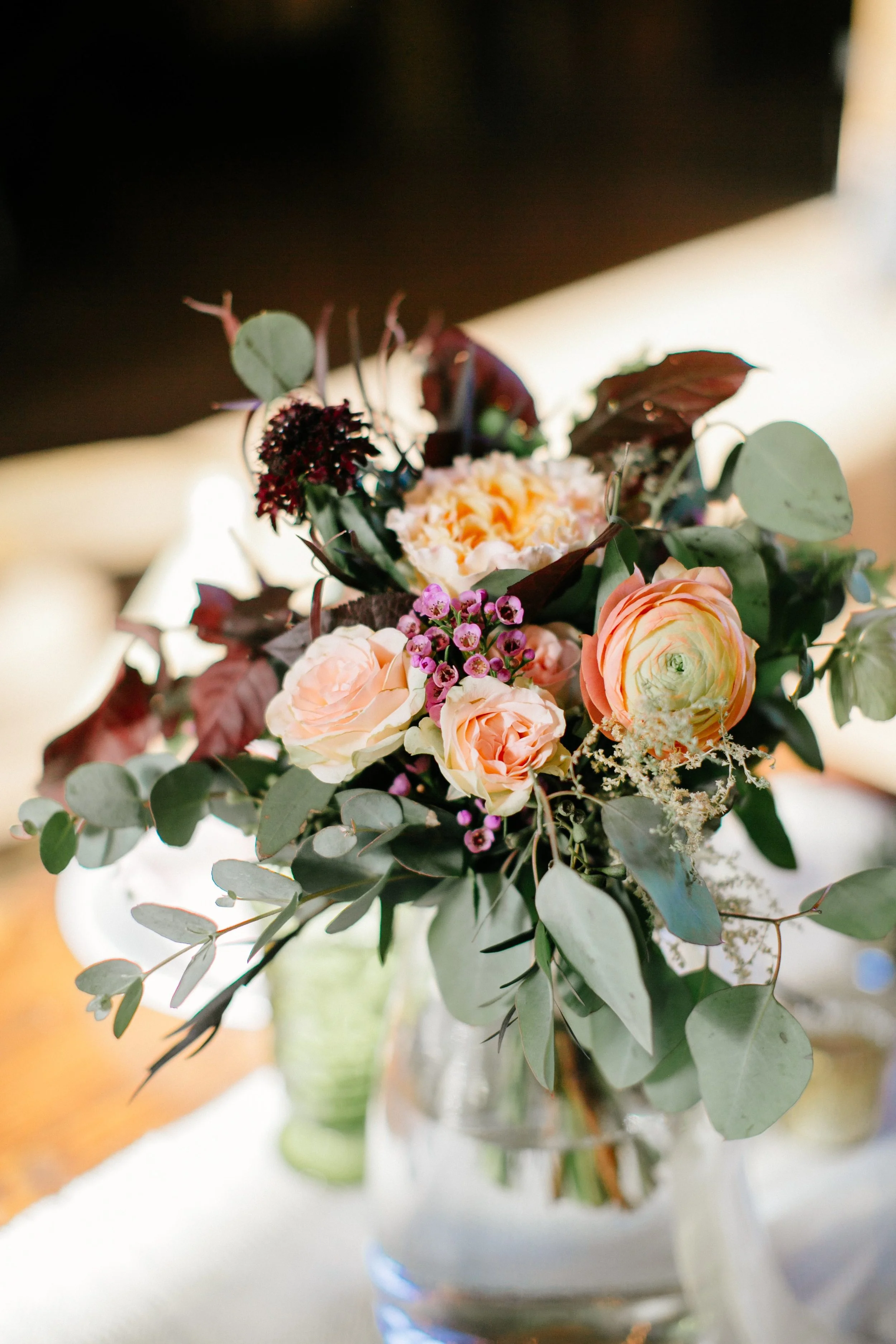 Peach Ranunculus, maroon foliage // Nashville Wedding Florist