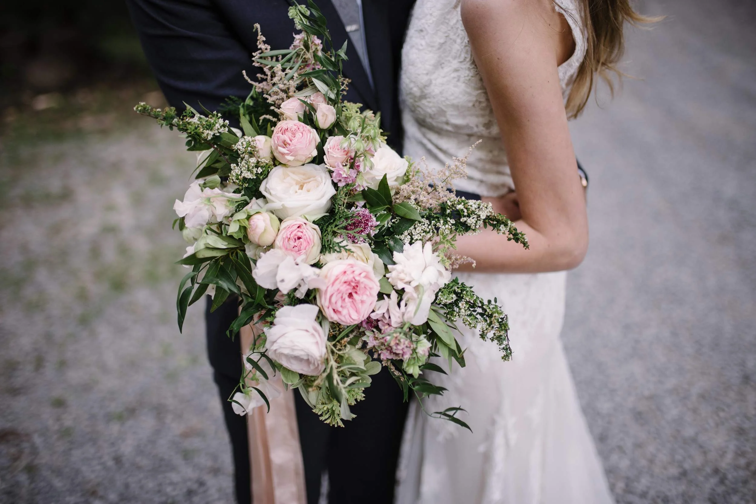 Lush bridal bouquet with garden roses, ranunculus, and sweet peas // Nashville Wedding Florist