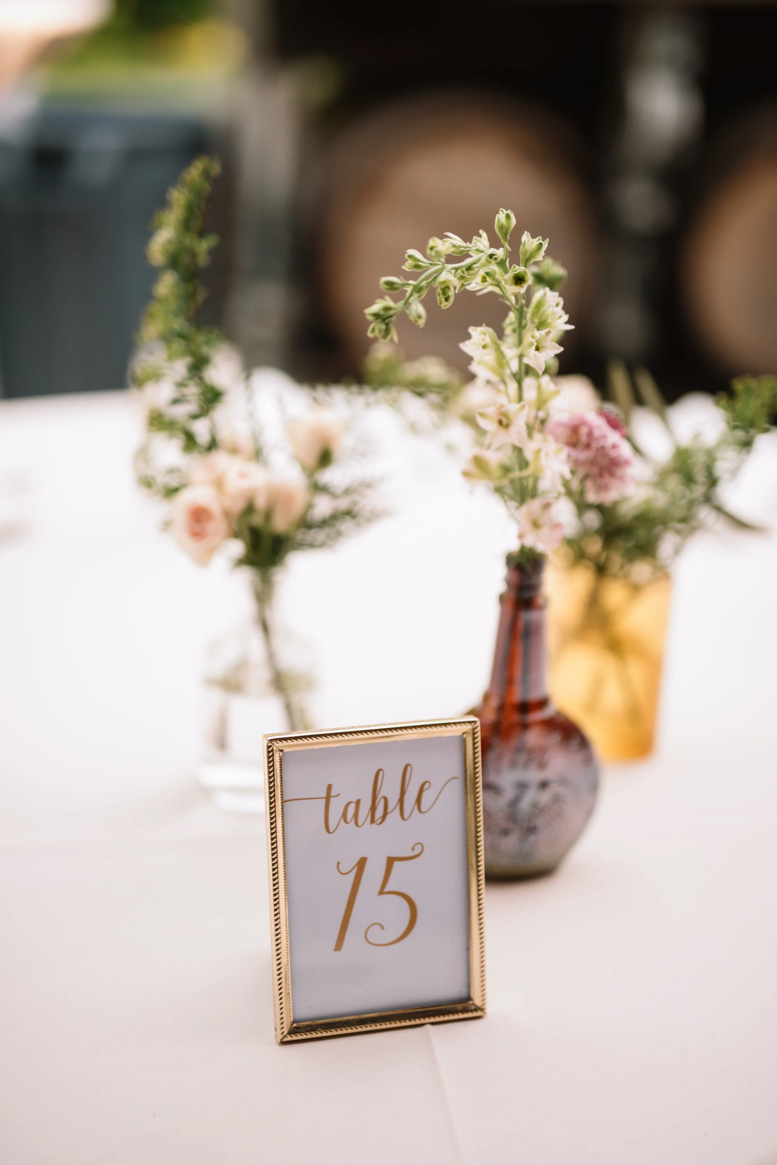 Amber bud vases with blush and white and greenery florals // Nashville Wedding Flowers