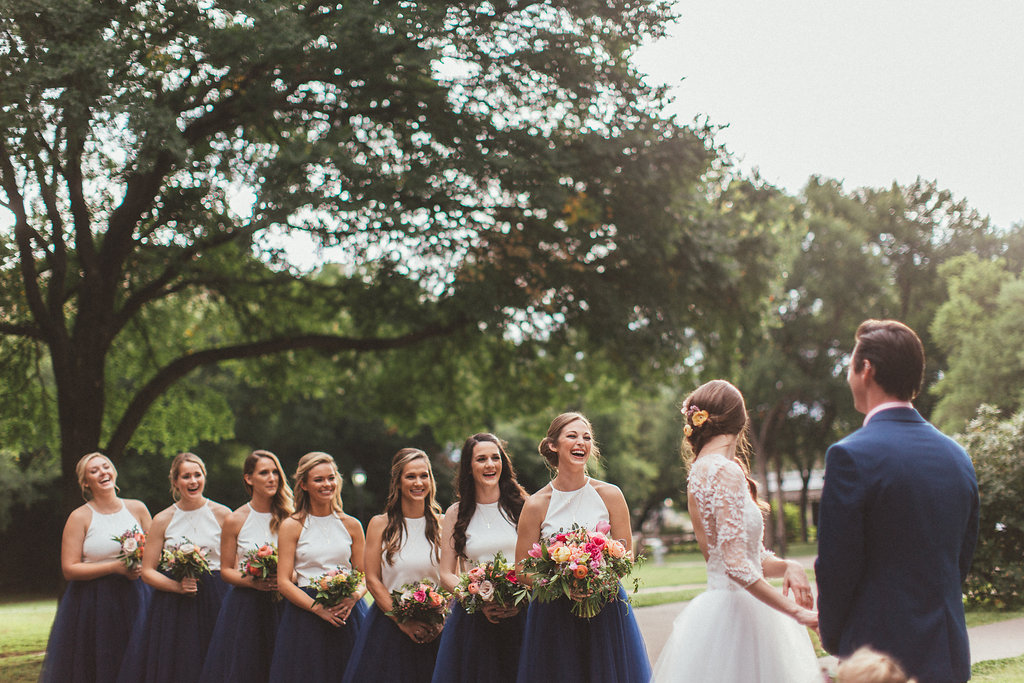 Navy tulle skirts for the bridesmaids, pink and coral florals // Dallas Wedding Floral Design