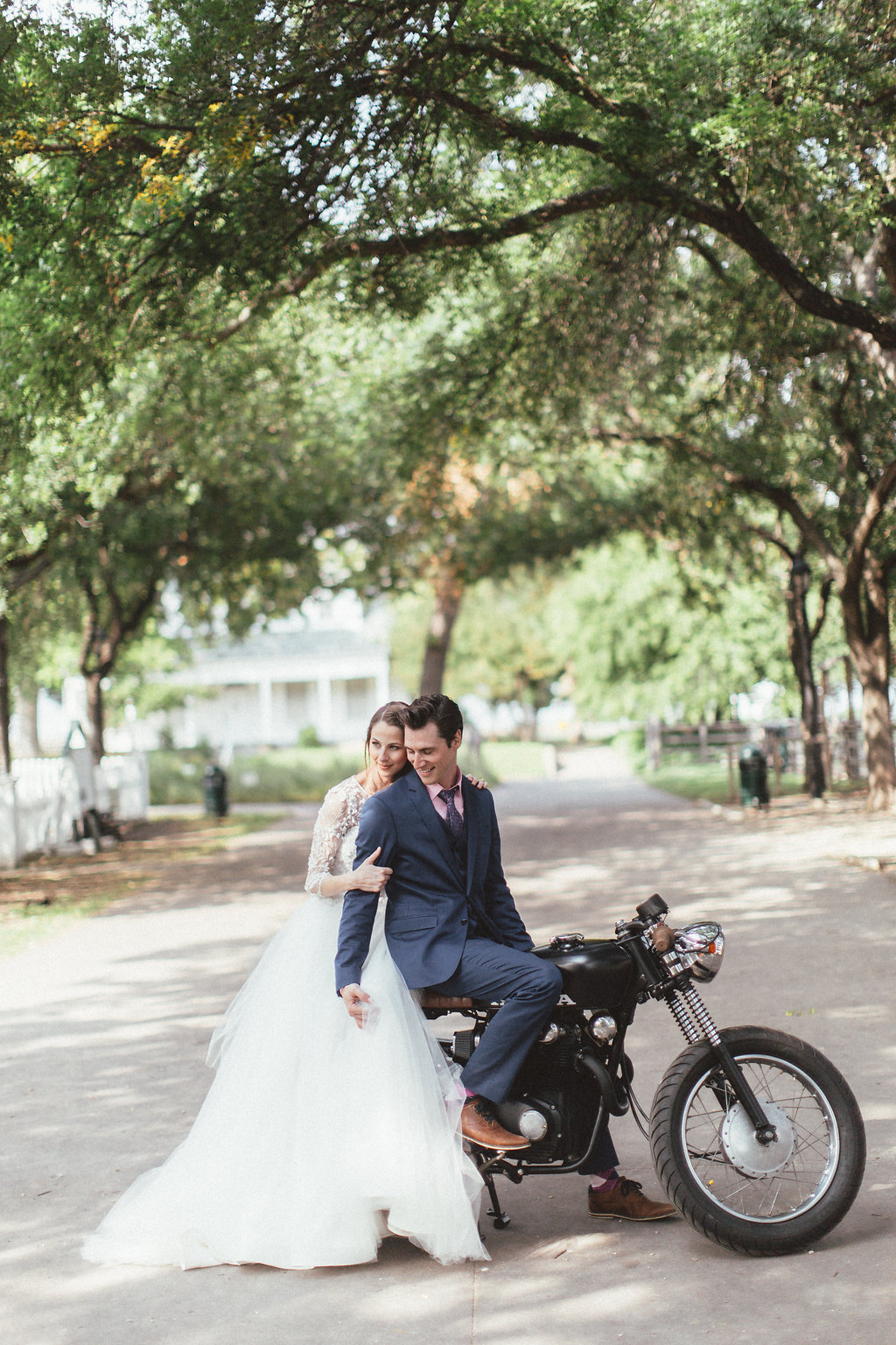 Bride and Groom on a motorcycle // Dallas Wedding Floral Design