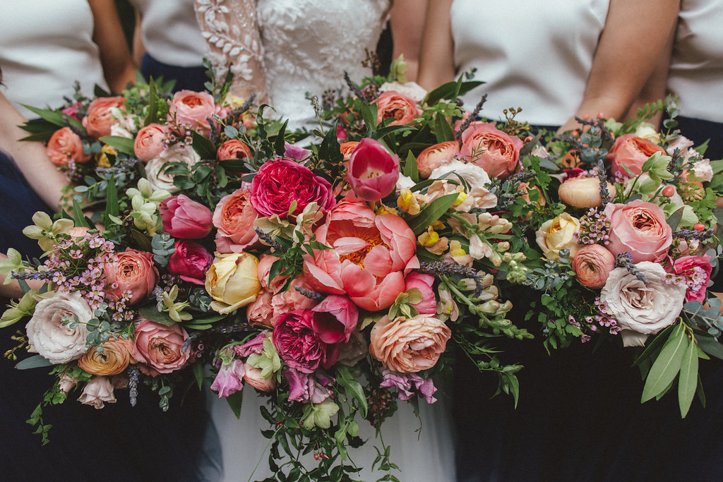 Coral, pinks, and peach florals with lush, trailing greenery // Nashville Floral Design for Weddings