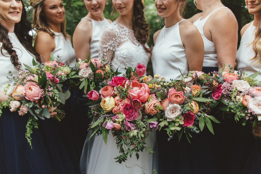Coral, pinks, and peach florals with lush, trailing greenery // Dallas Floral Design for Weddings