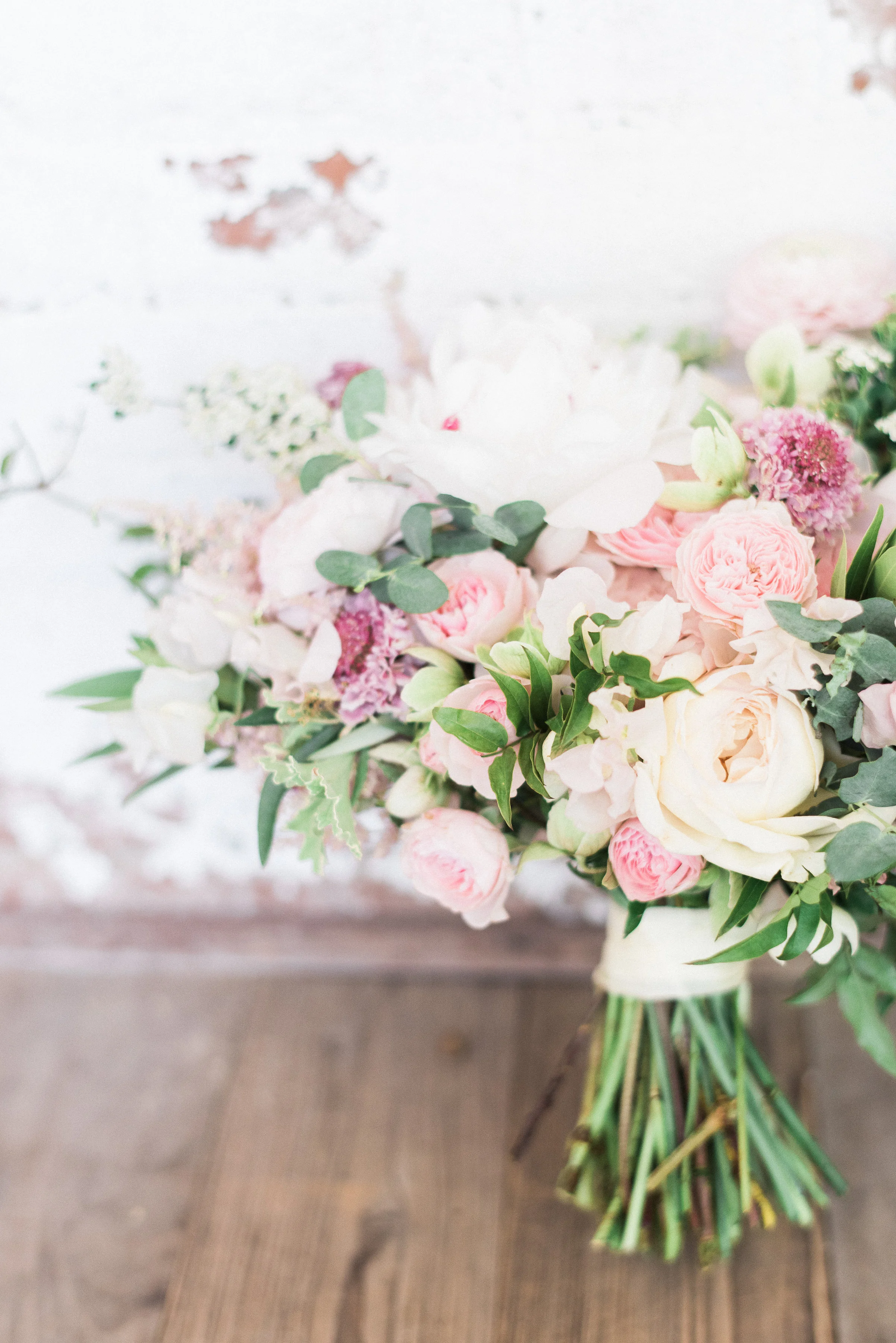 Blush and ivory bridal bouquet with peonies, ranunculus, and lush greenery // Nashville Wedding Florist