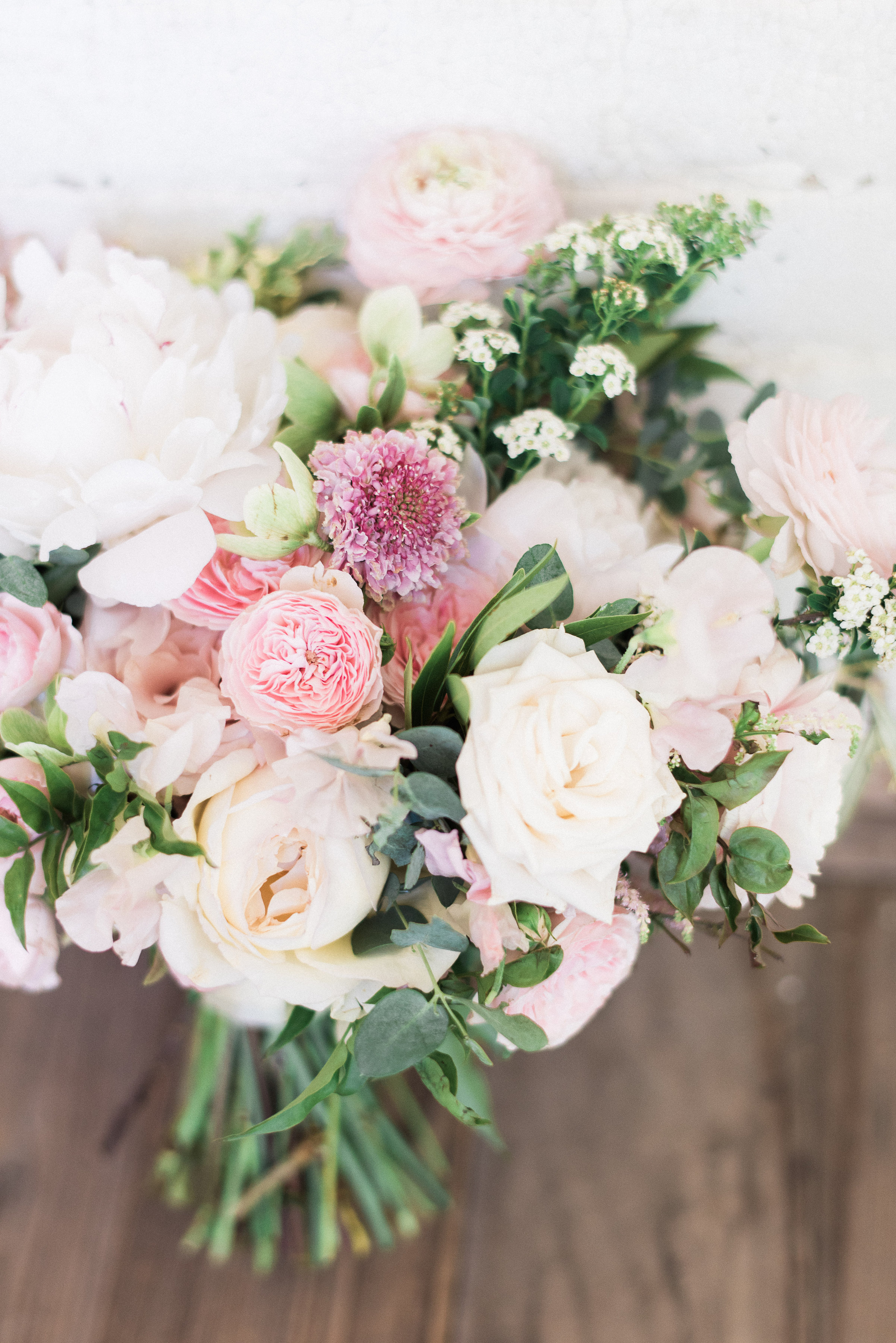Blush and ivory bridal bouquet with peonies, ranunculus, and lush greenery // Nashville Wedding Florist