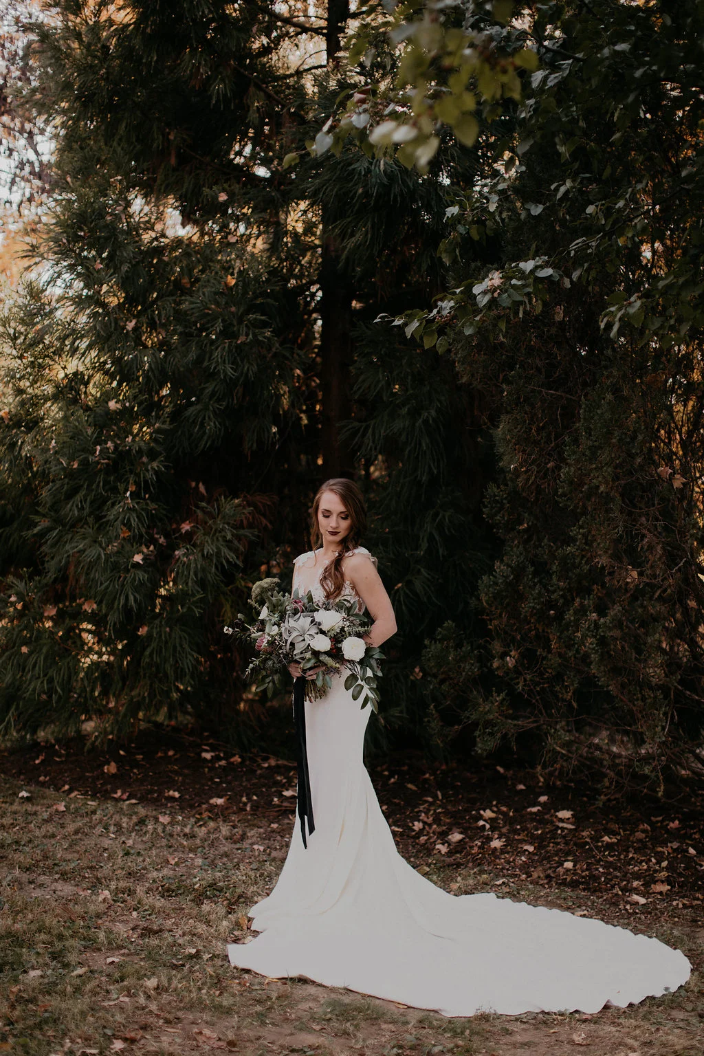 Wintry Bridal Bouquet with air plants, peonies, berries, eucalyptus, and loose, untamed greenery // Nashville Florist
